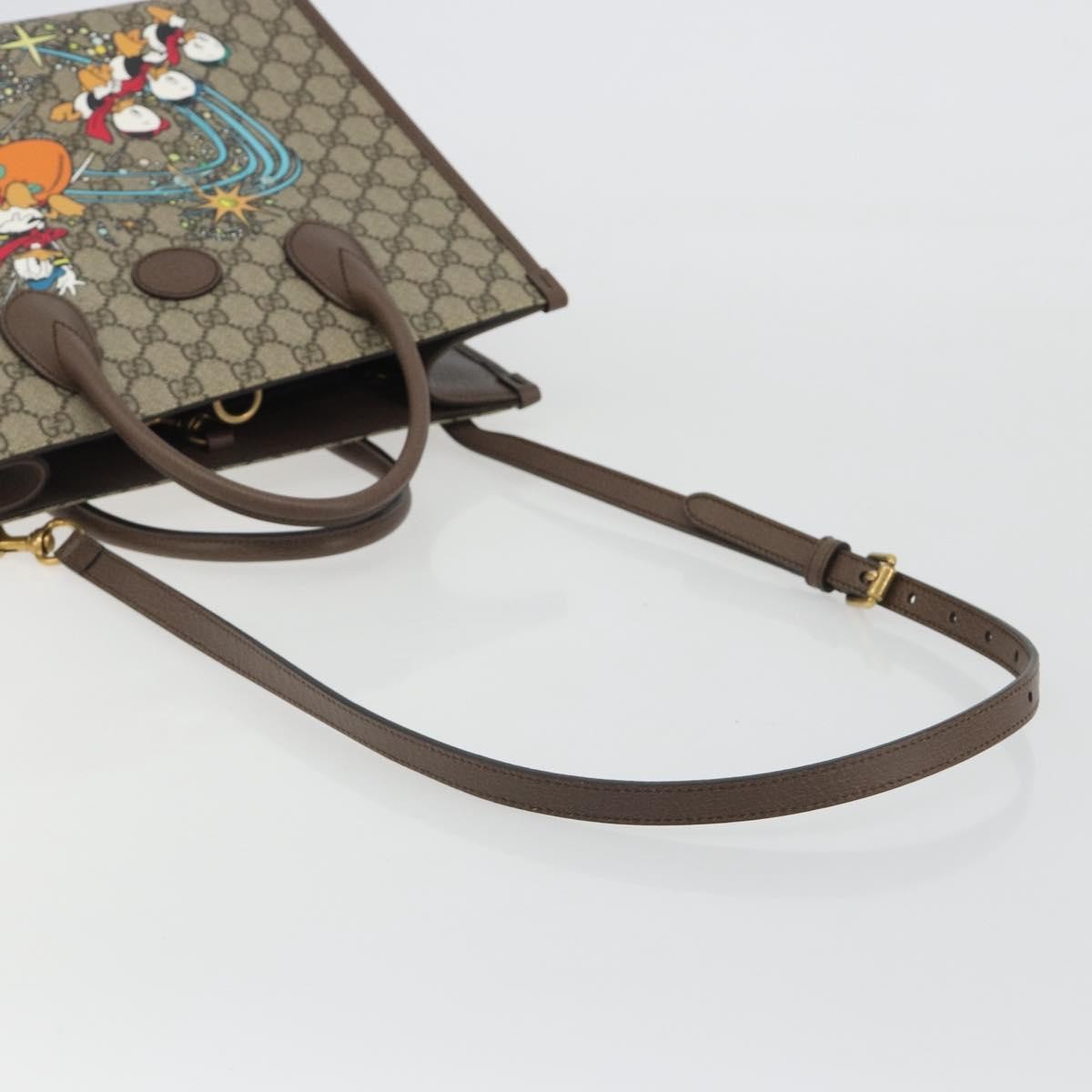 Gucci Disney Donald Duck Convertible Printed Gg Coated Canvas Beige Canvas Tote Bag Bag (Pre-Owned)