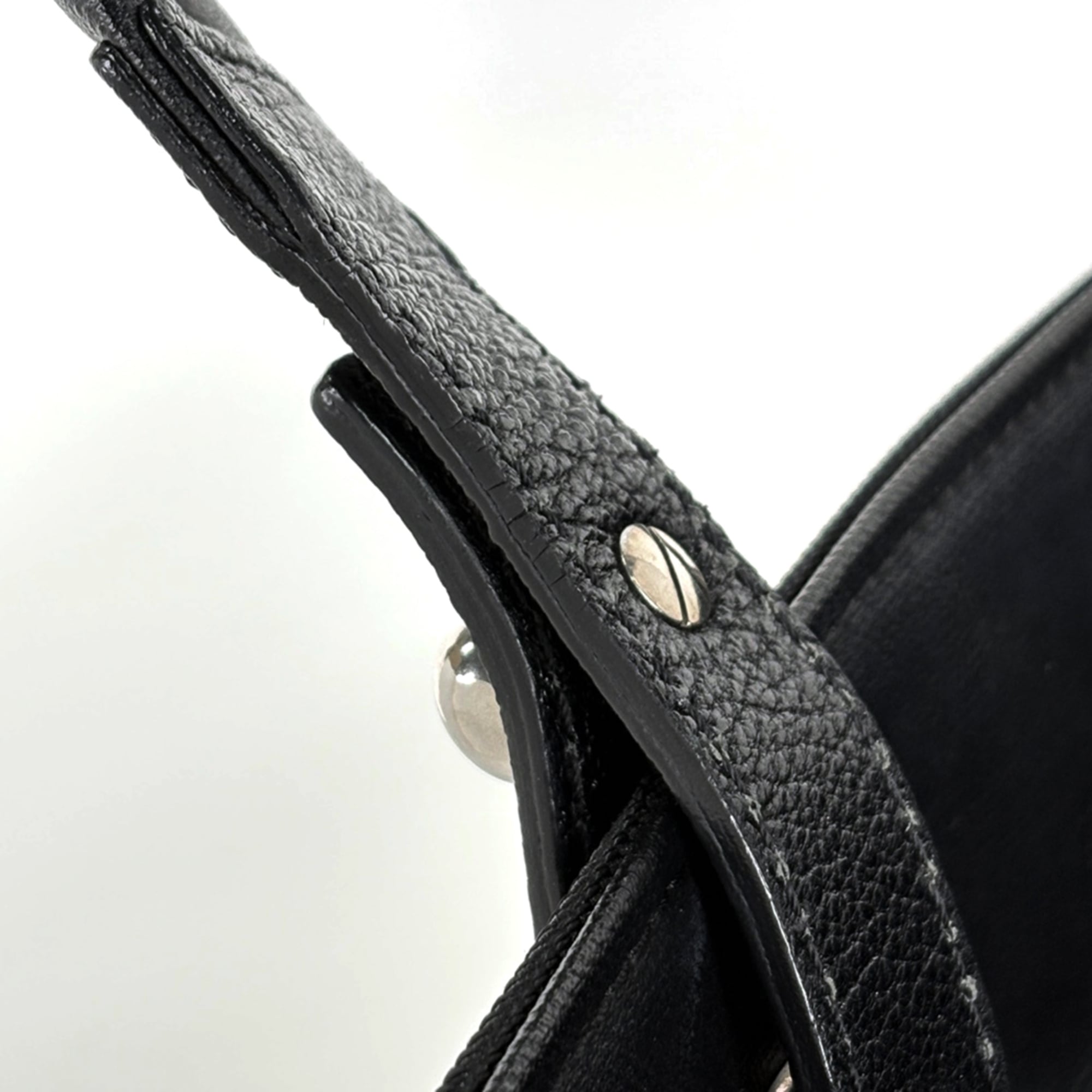 Chanel Black Coated Canvas Handbag (Pre-Owned)
