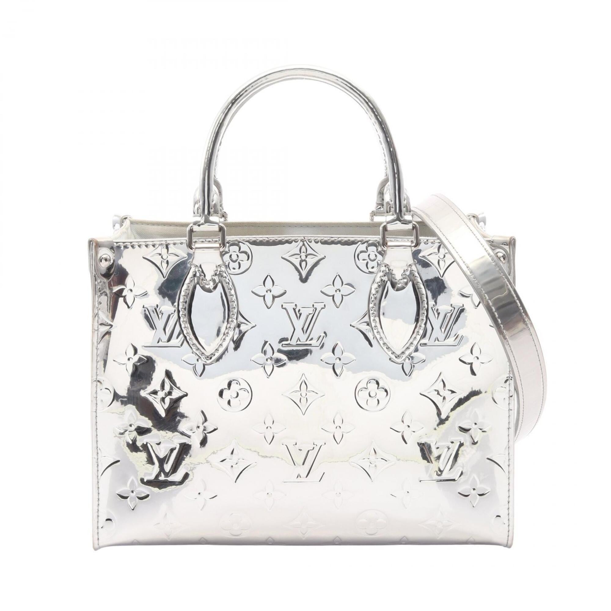 Louis Vuitton Argent Silver Coated Canvas Handbag (Pre-Owned)