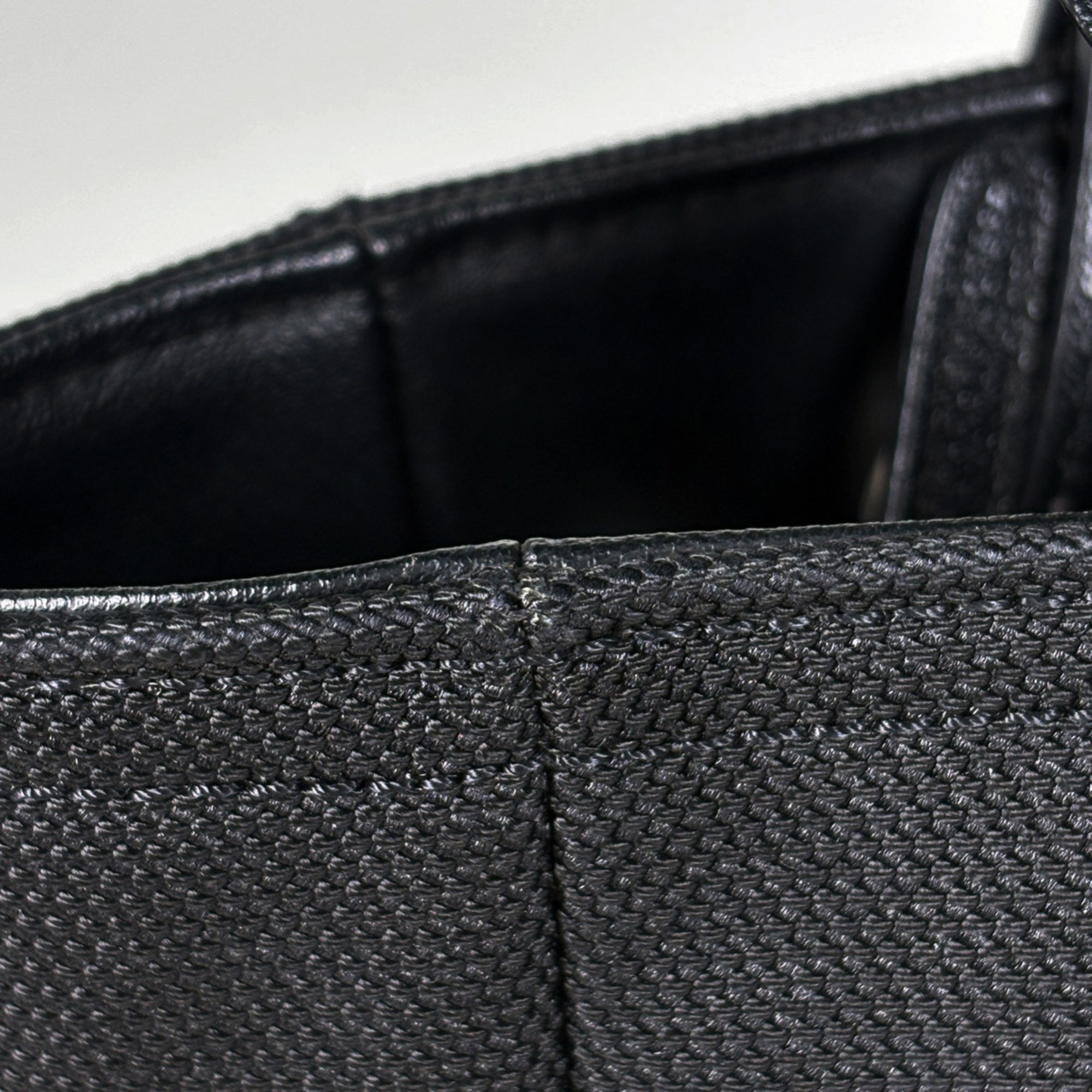 Chanel Black Coated Canvas Handbag (Pre-Owned)