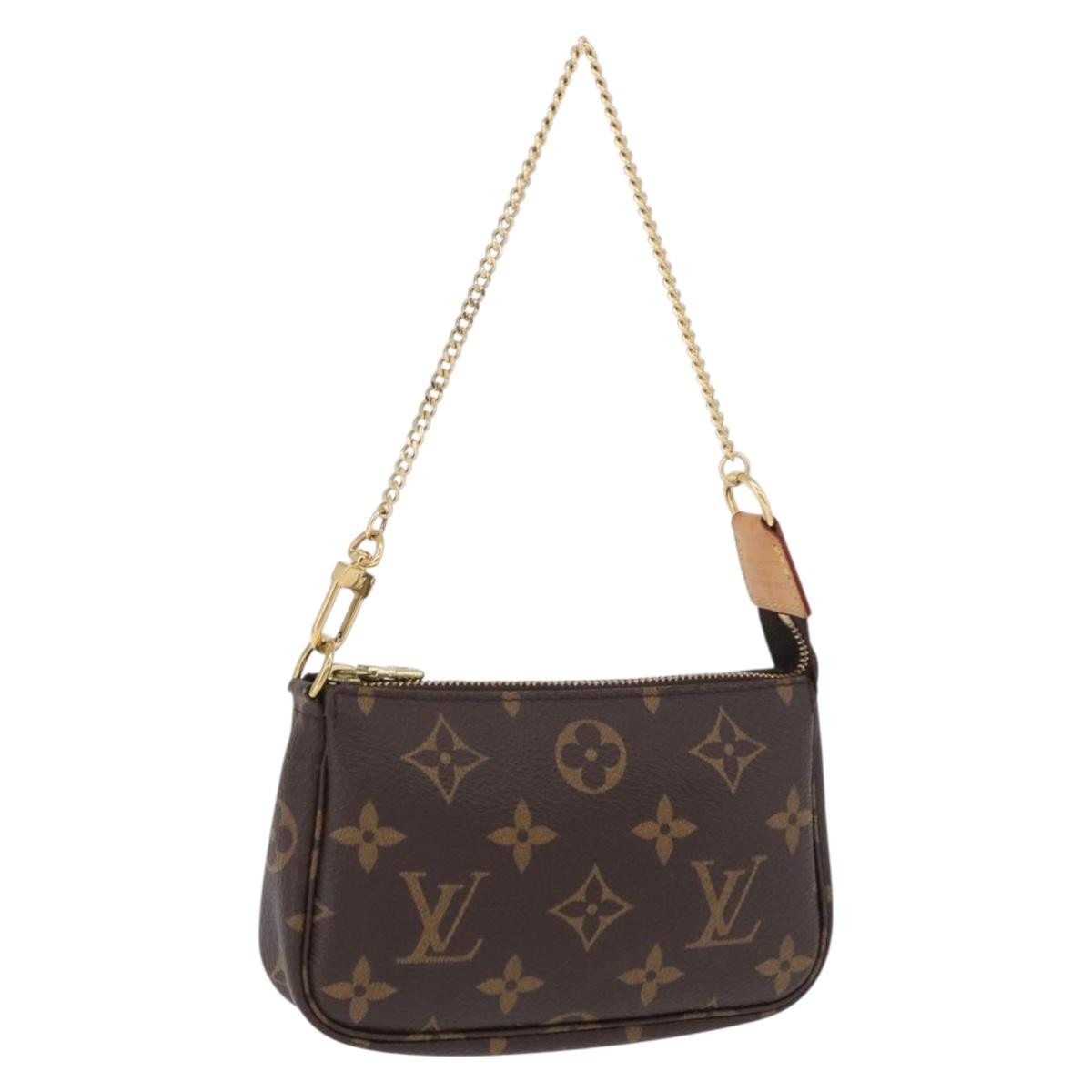 Louis Vuitton Mini Pochette Accessoires Canvas Brown Canvas Clutche & Pouche Bag (Pre-Owned)
