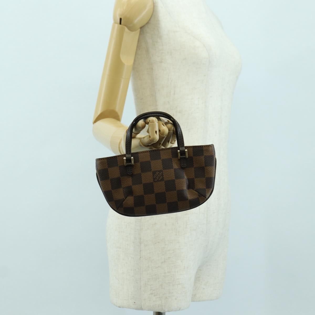 Louis Vuitton Manosque Pochette Damier Ebene Brown Canvas Clutche & Pouche Bag (Pre-Owned)