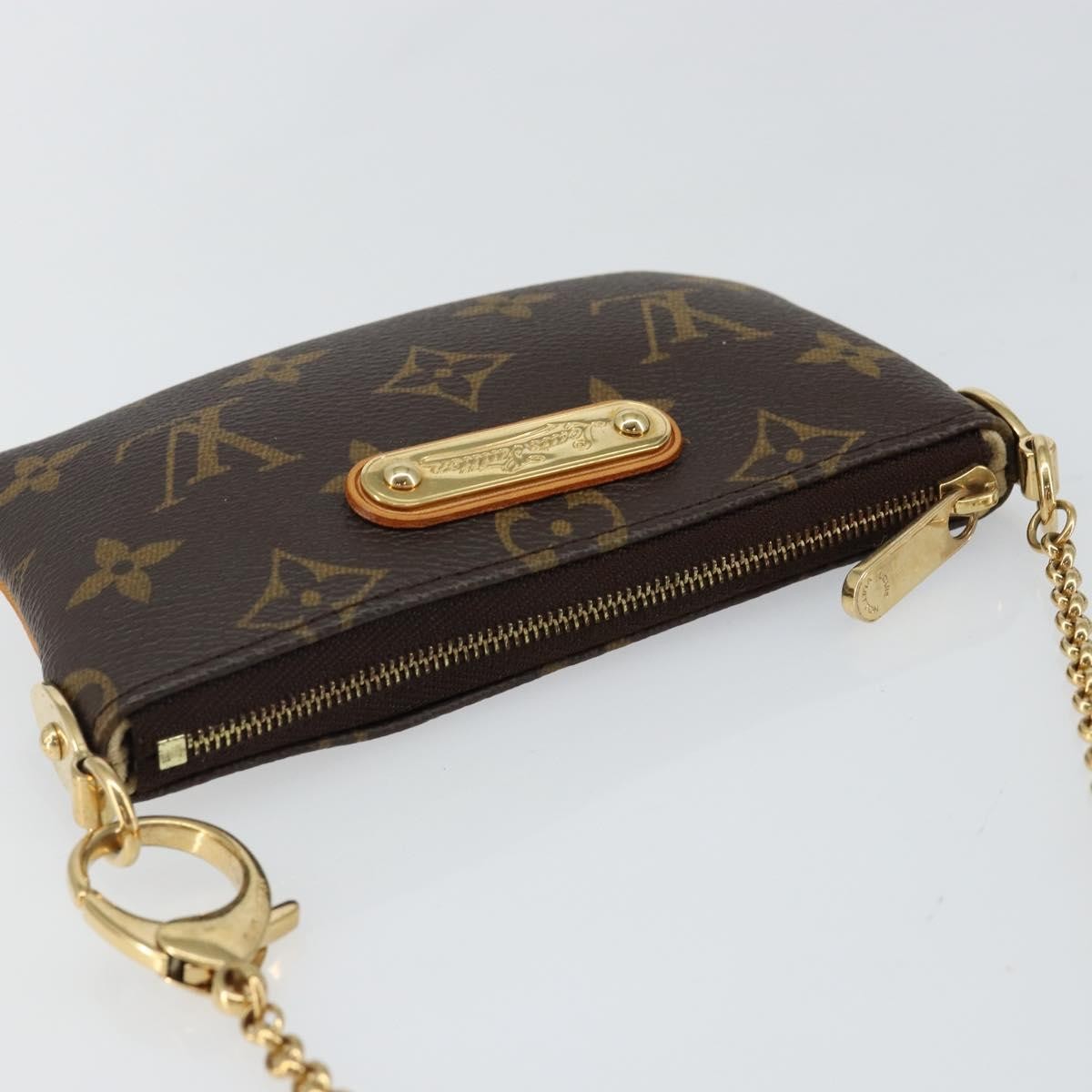 Louis Vuitton Milla Pochette Monogram Canvas Brown Canvas Clutche & Pouche Bag (Pre-Owned)
