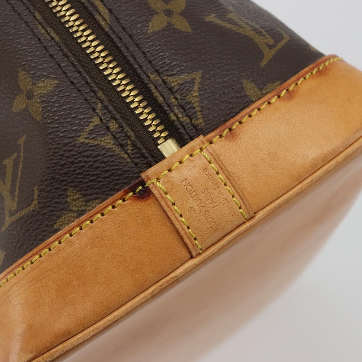 Louis Vuitton Alma Monogram Brown Canvas Handbag (Pre-Owned)