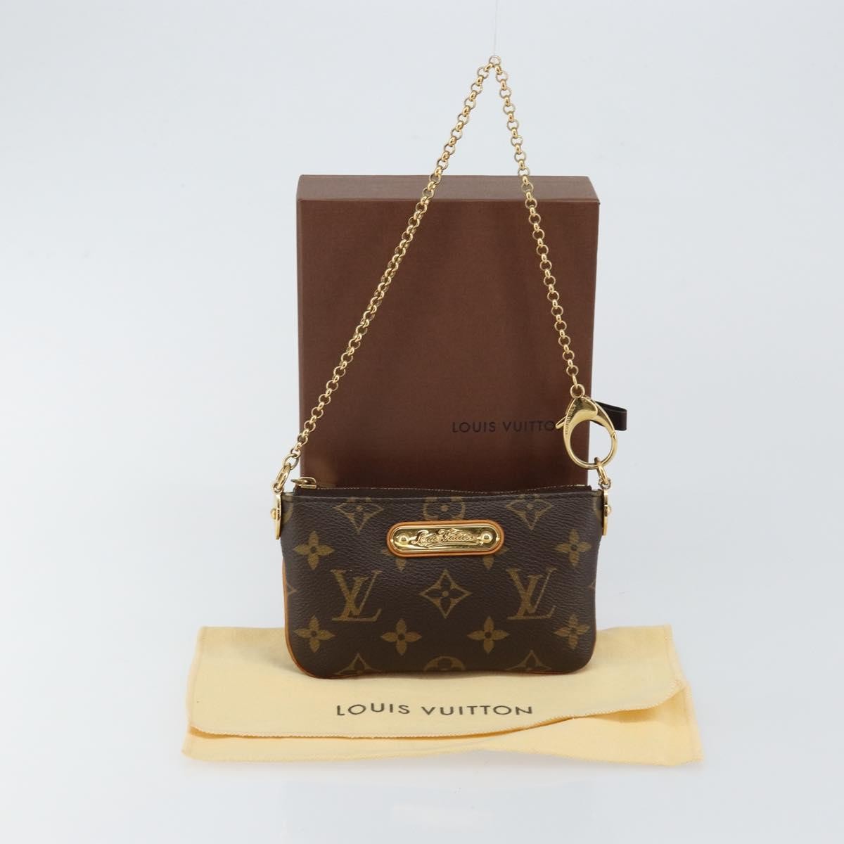 Louis Vuitton Milla Pochette Monogram Canvas Brown Canvas Clutche & Pouche Bag (Pre-Owned)