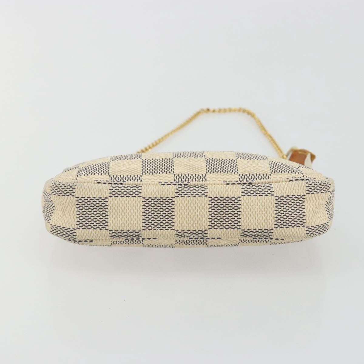 Louis Vuitton Mini Pochette Accessoires Damier Canvas Beige Canvas Clutche & Pouche Bag (Pre-Owned)