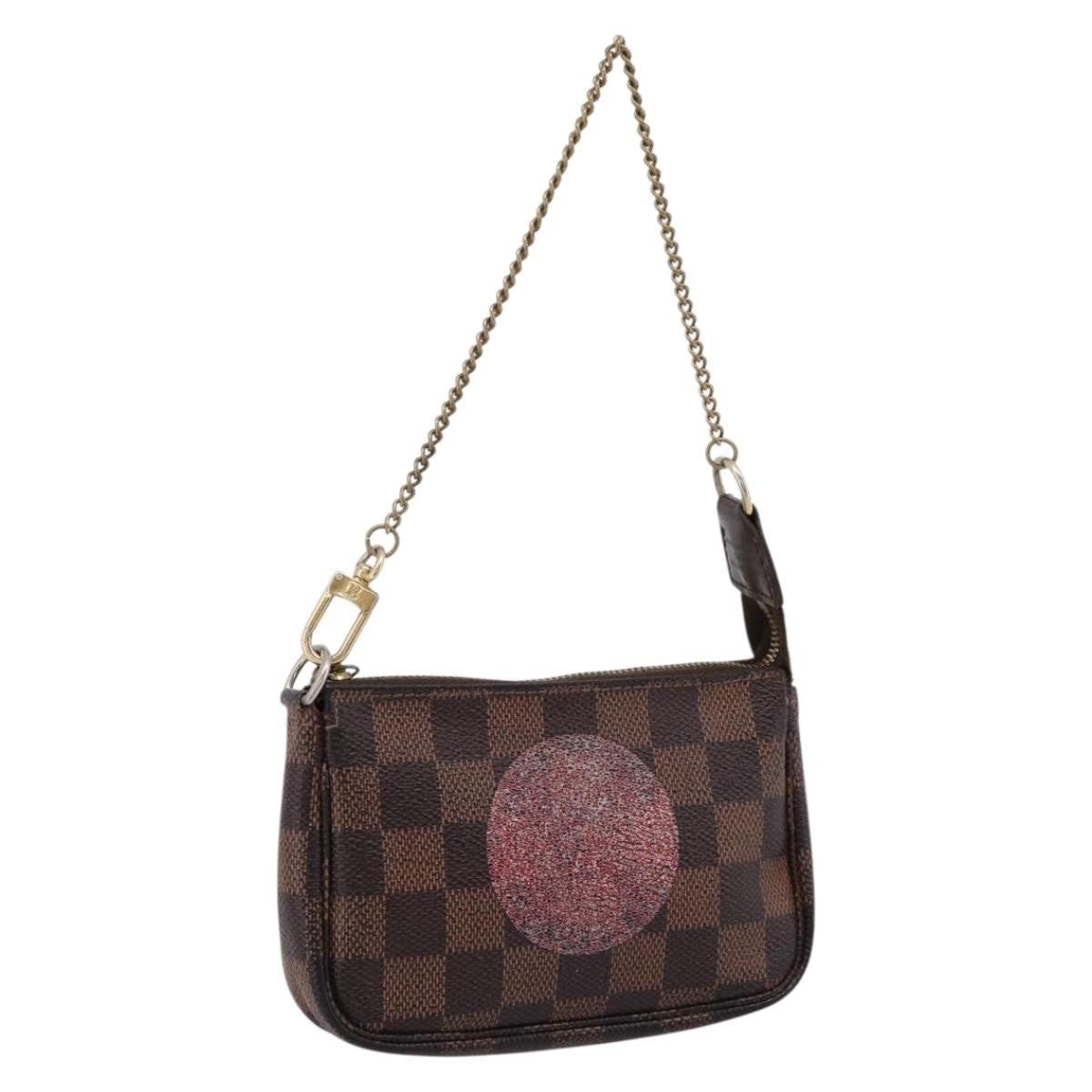 Louis Vuitton Mini Pochette Accessoires Damier Canvas Brown Canvas Clutche & Pouche Bag (Pre-Owned)