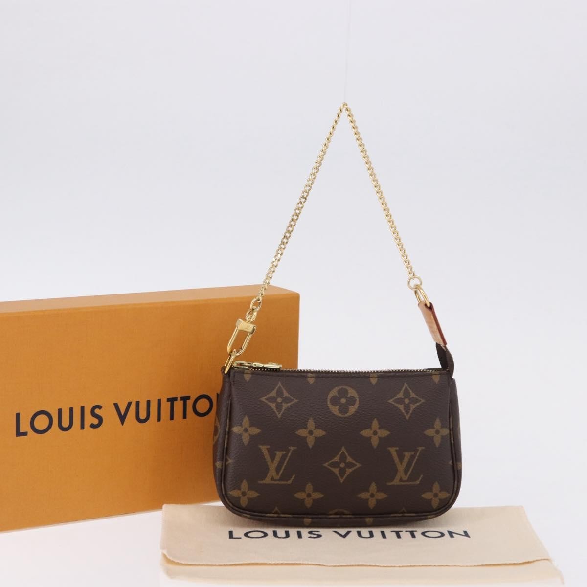 Louis Vuitton Mini Pochette Accessoires Canvas Brown Canvas Clutche & Pouche Bag (Pre-Owned)