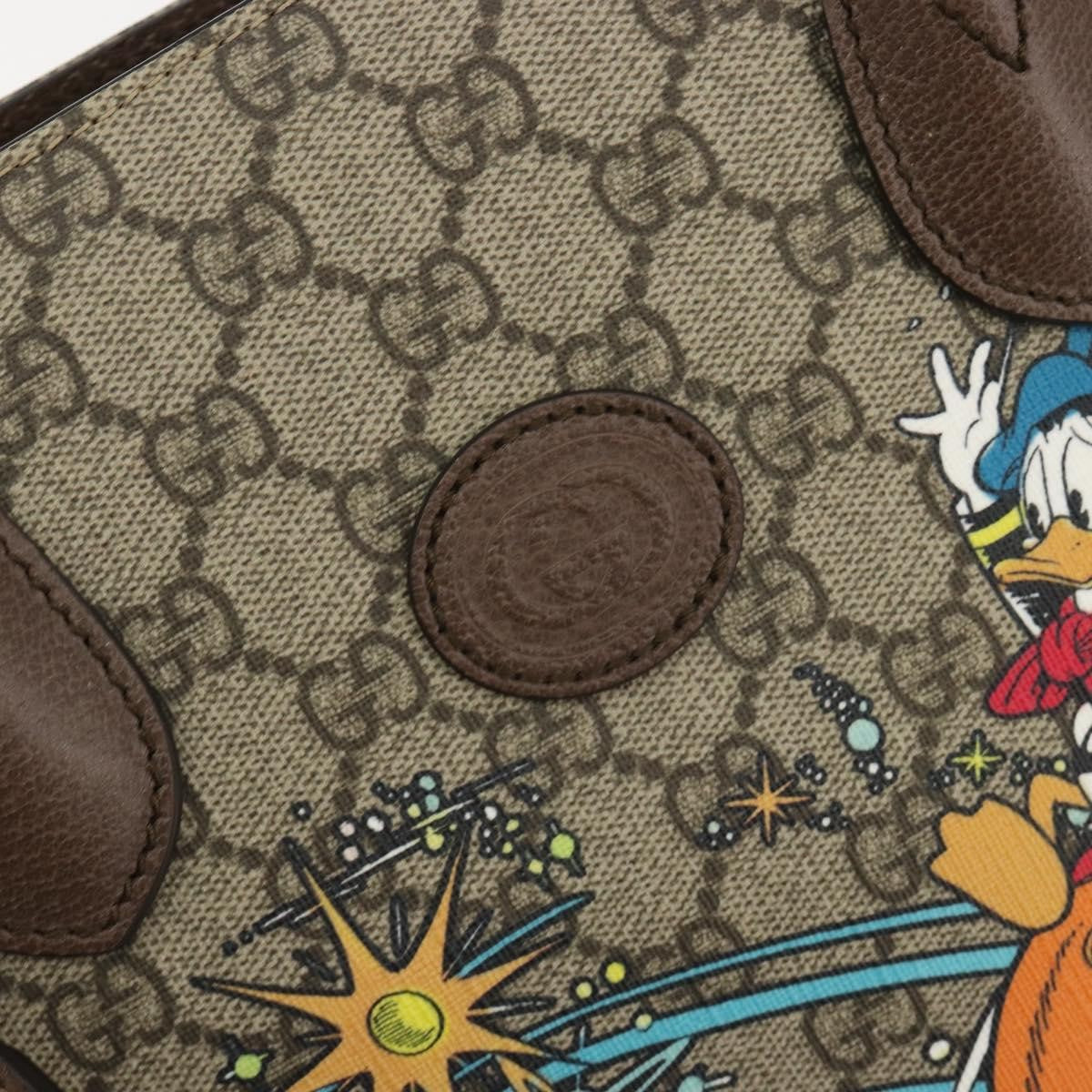 Gucci Disney Donald Duck Convertible Printed Gg Coated Canvas Beige Canvas Tote Bag Bag (Pre-Owned)
