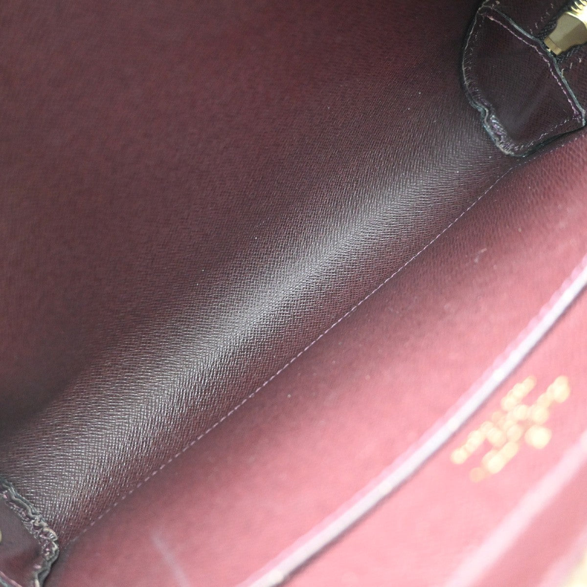 Louis Vuitton Pochette Baikal Clutch Taiga Leather Burgundy Leather Clutche & Pouche Bag (Pre-Owned)