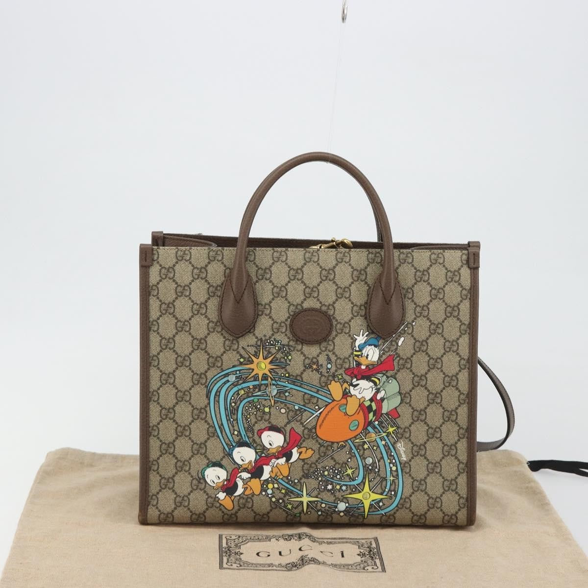 Gucci Disney Donald Duck Convertible Printed Gg Coated Canvas Beige Canvas Tote Bag Bag (Pre-Owned)