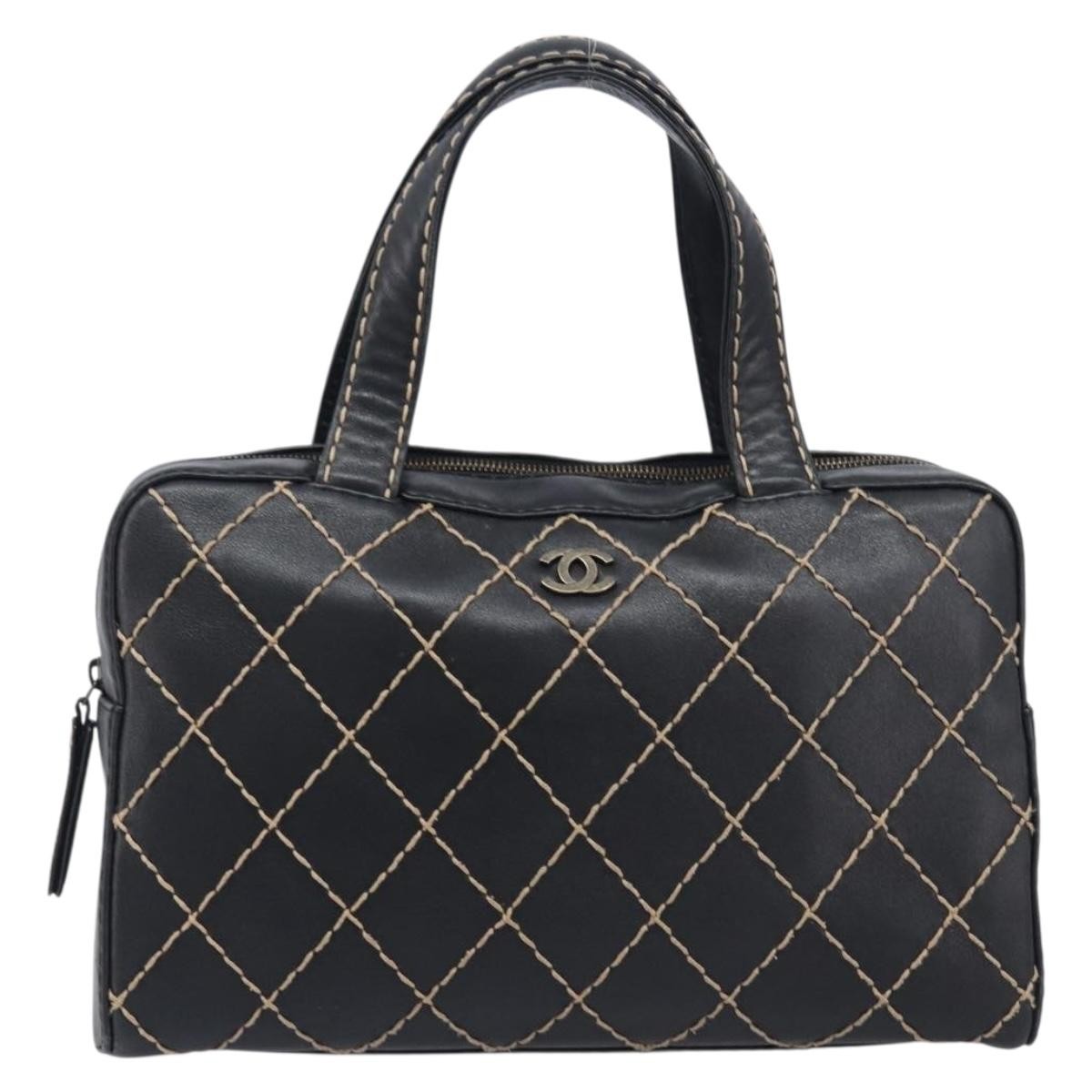 Chanel Surpique Boston Quilted Leather Black Leather Handbag (Pre-Owned)