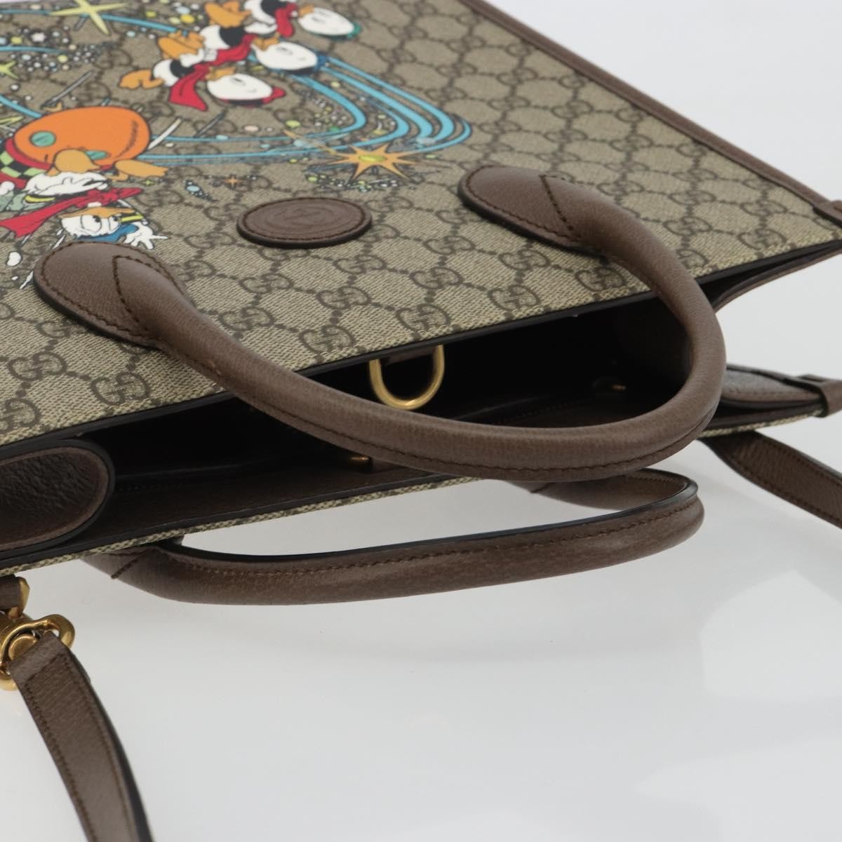 Gucci Disney Donald Duck Convertible Printed Gg Coated Canvas Beige Canvas Tote Bag Bag (Pre-Owned)