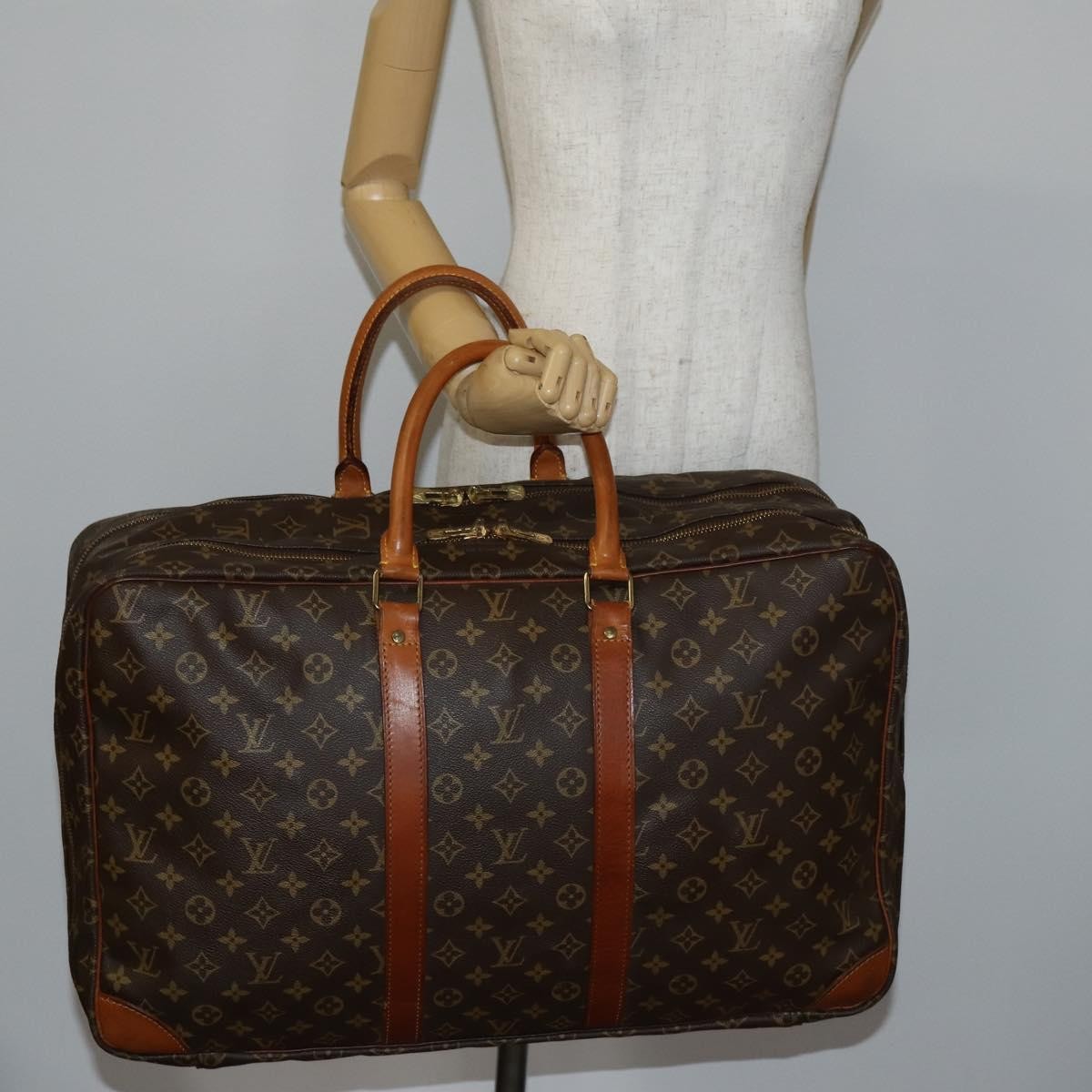 Louis Vuitton Sirius Handbag Monogram Canvas Brown Canvas Travel Bag Bag (Pre-Owned)