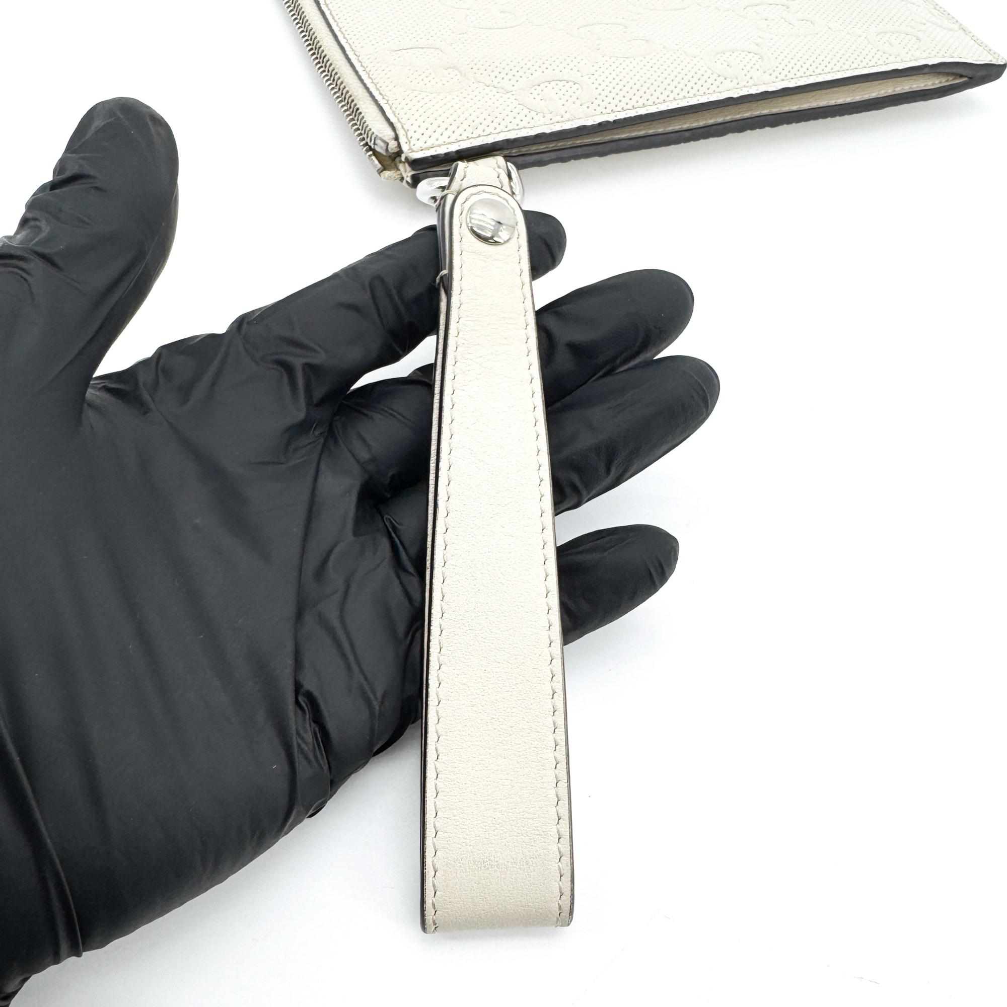 Gucci Wristlet Gg Embossed Perforated Leather White Leather Clutche & Pouche Bag (Pre-Owned)