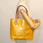 Louis Vuitton Houston Yellow Patent Leather Handbag (Pre-Owned)