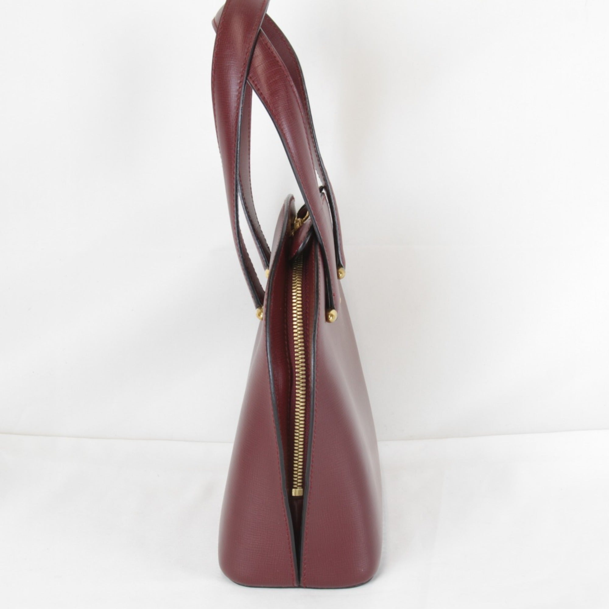 Cartier Must Wine Red Leather Handbag (Pre-Owned)