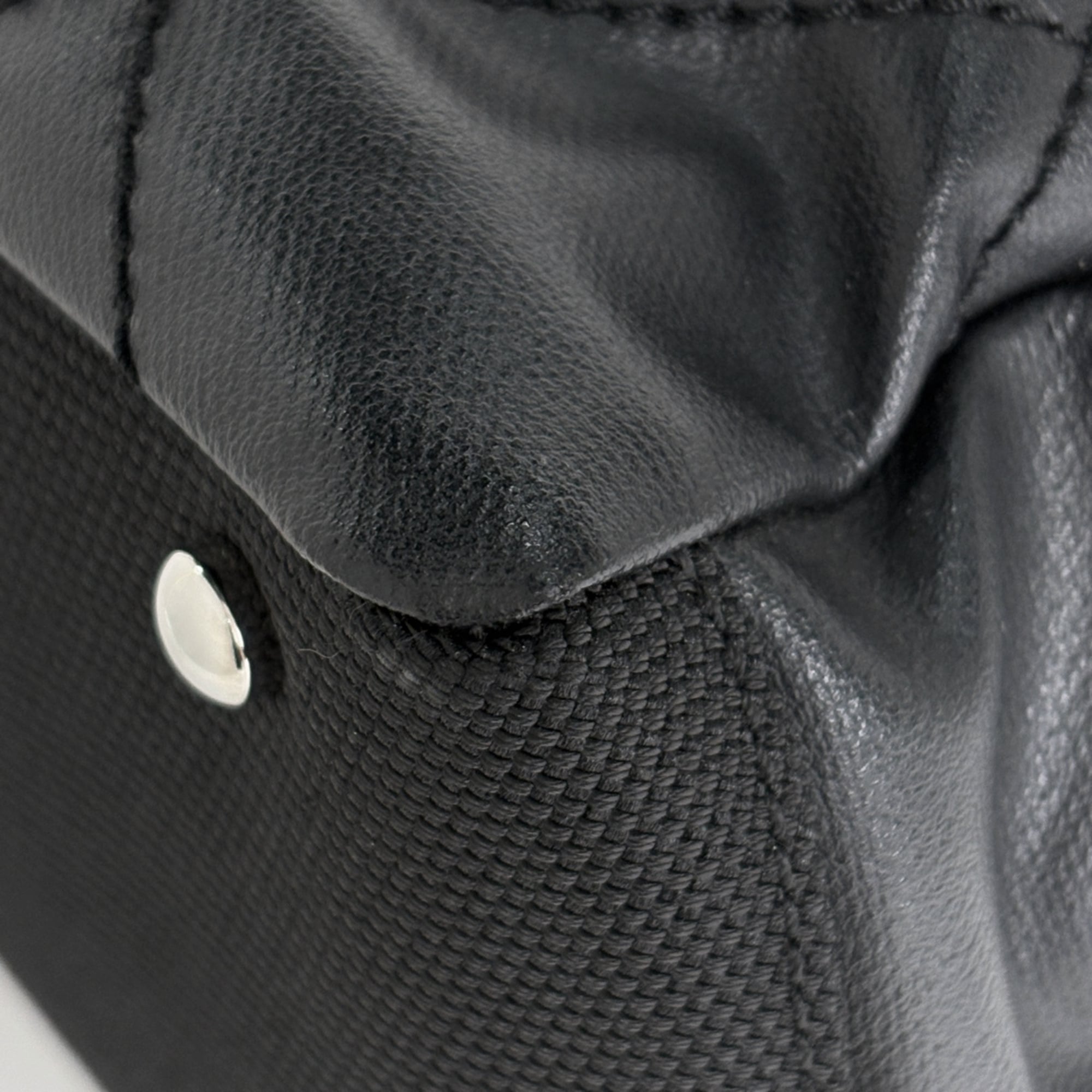 Chanel Black Coated Canvas Handbag (Pre-Owned)