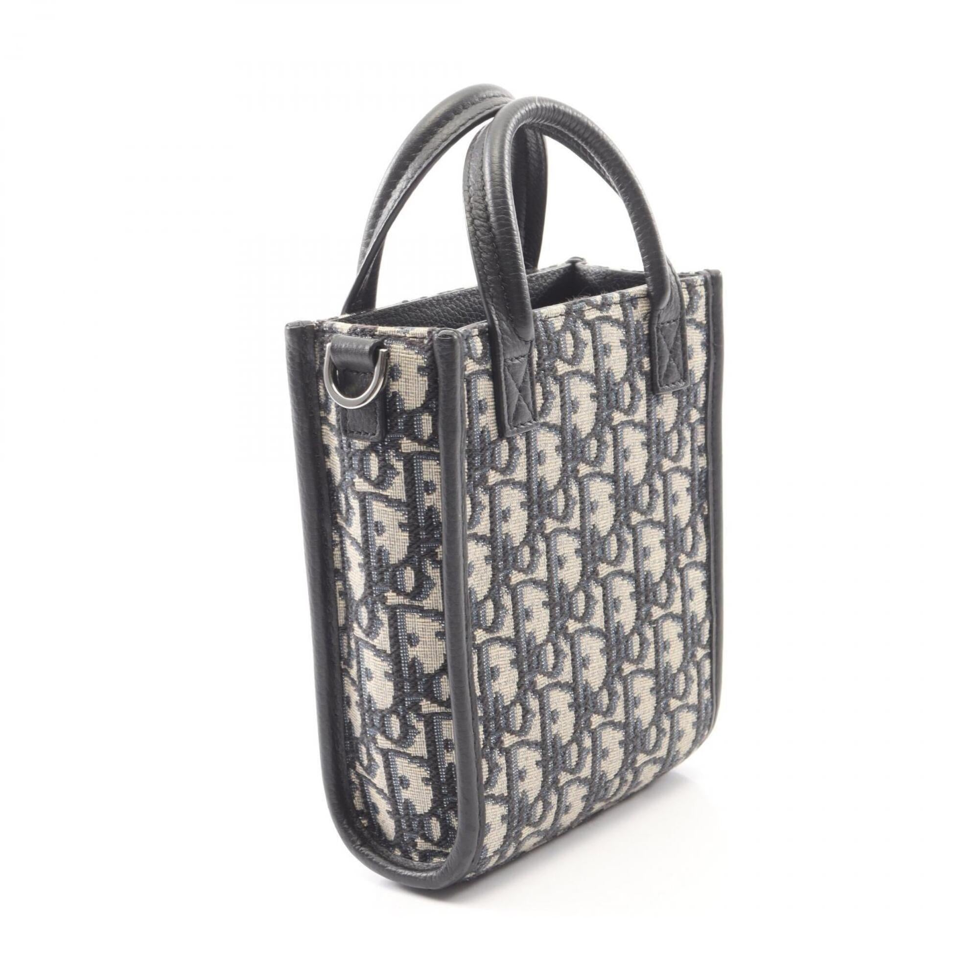 Christian Dior Beige Black Canvas Leather Handbag (Pre-Owned)