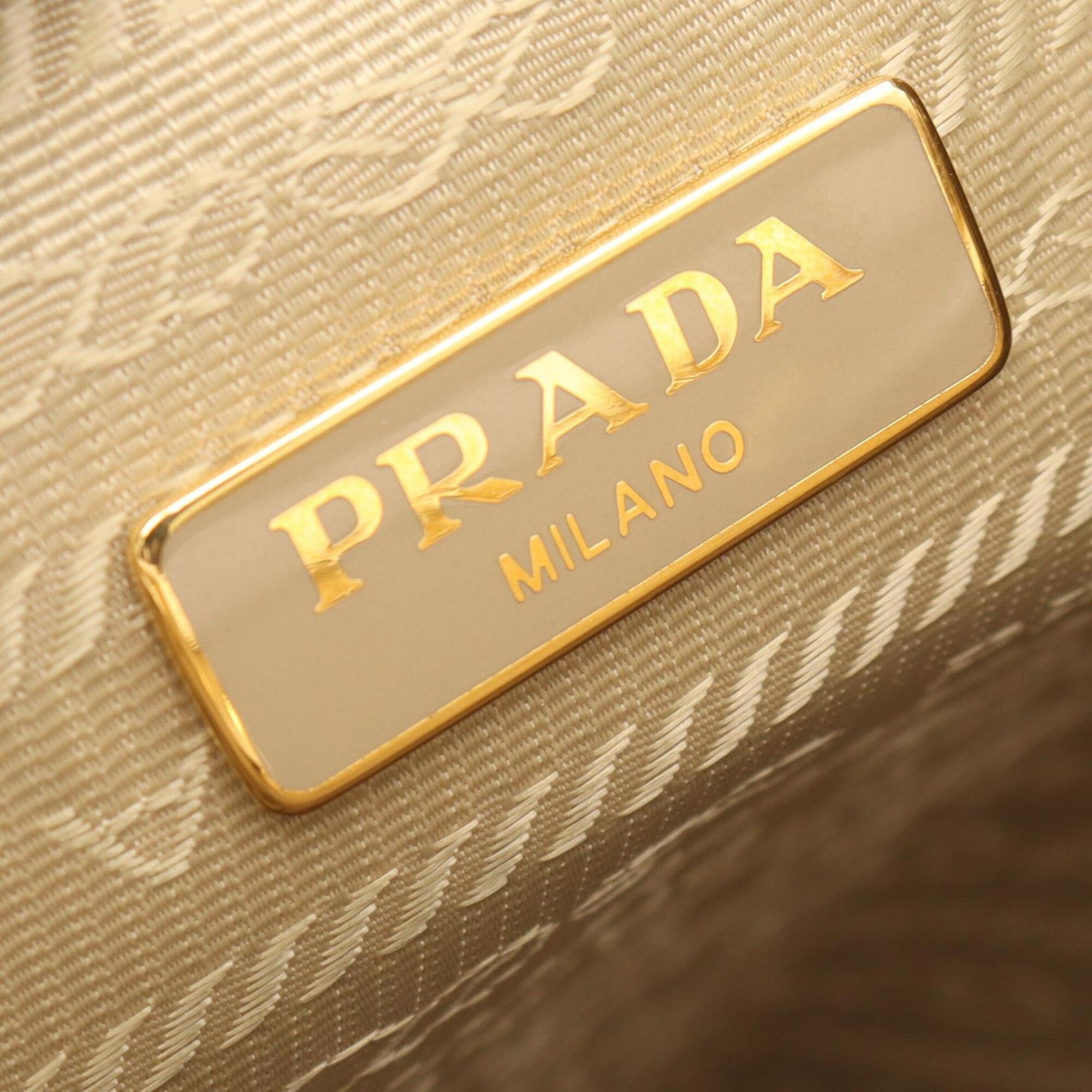 Prada Beige Brown White Canvas Leather Handbag (Pre-Owned)