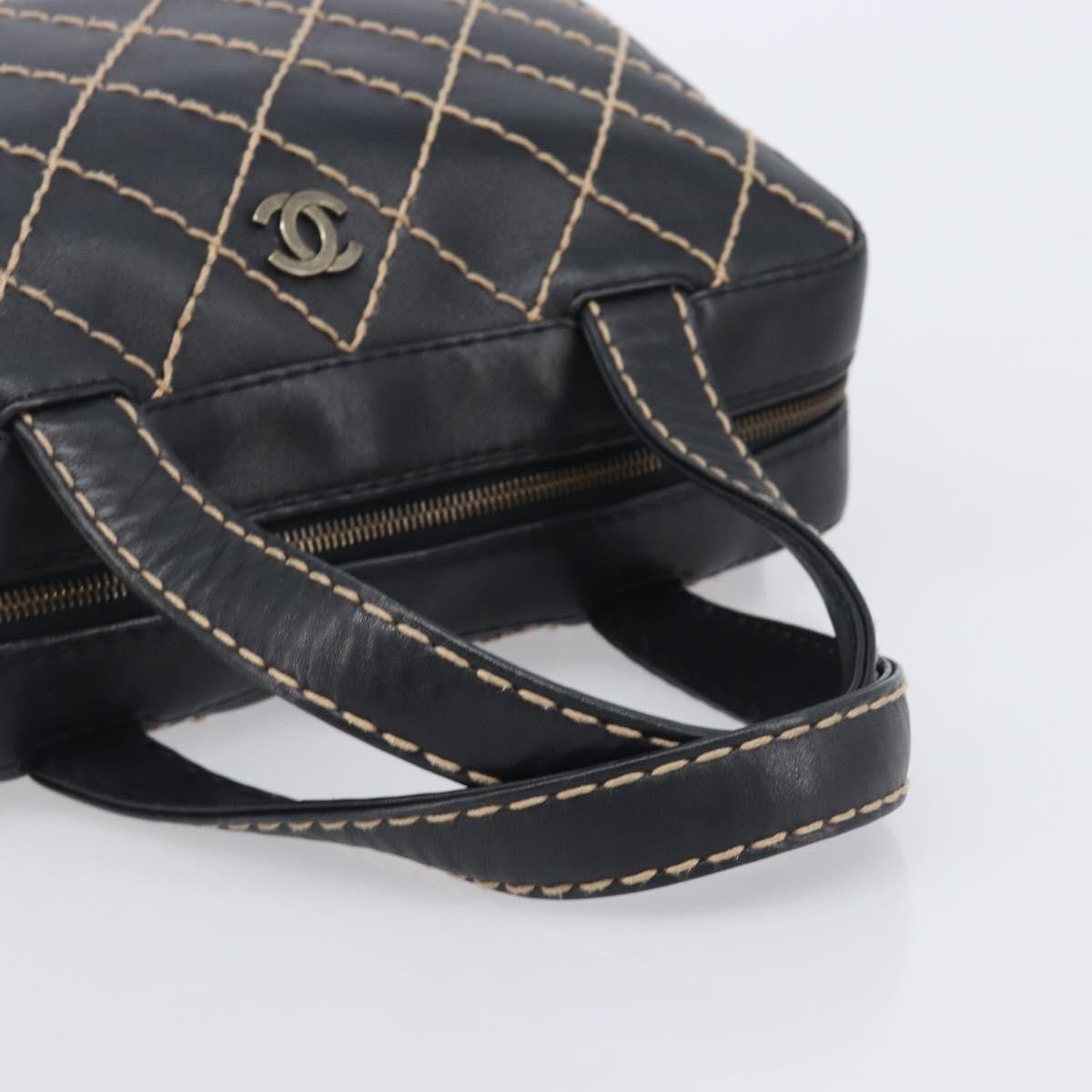 Chanel Surpique Boston Quilted Leather Black Leather Handbag (Pre-Owned)