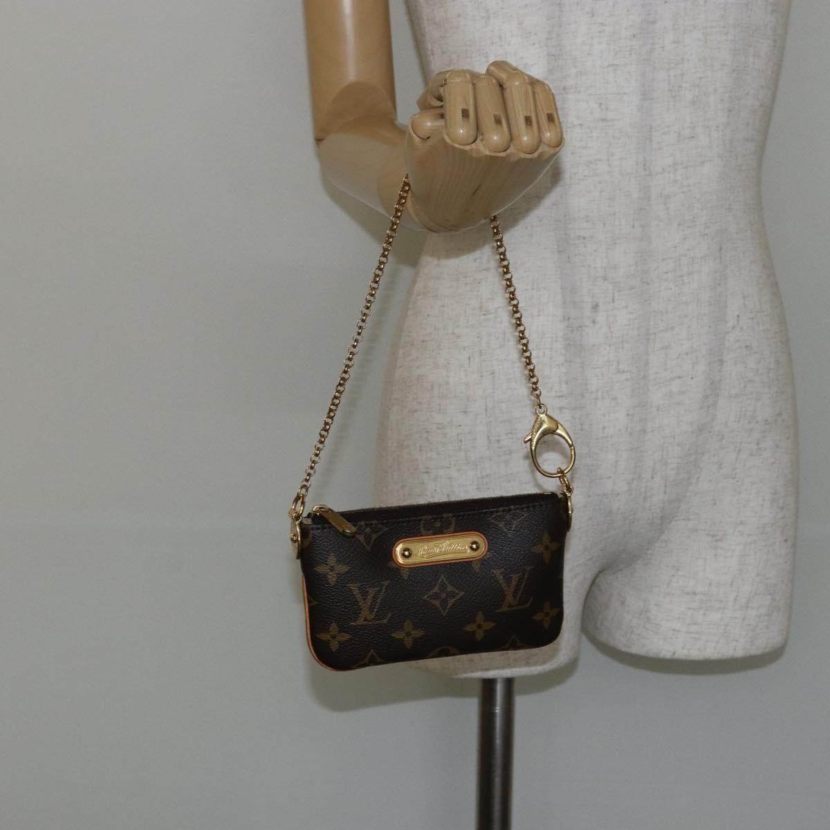 Louis Vuitton Milla Pochette Monogram Canvas Brown Canvas Clutche & Pouche Bag (Pre-Owned)