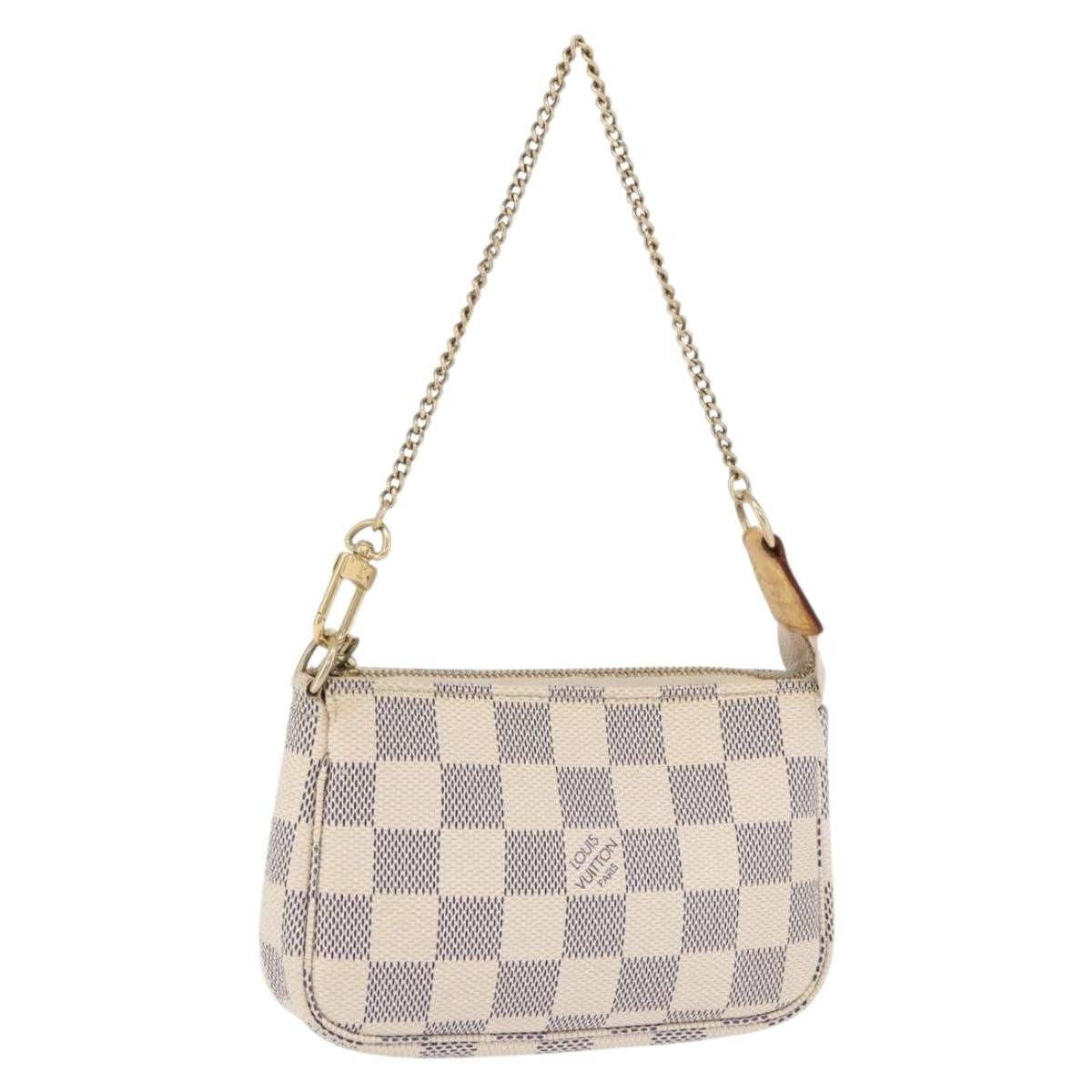 Louis Vuitton Mini Pochette Accessoires Damier Canvas Beige Canvas Clutche & Pouche Bag (Pre-Owned)