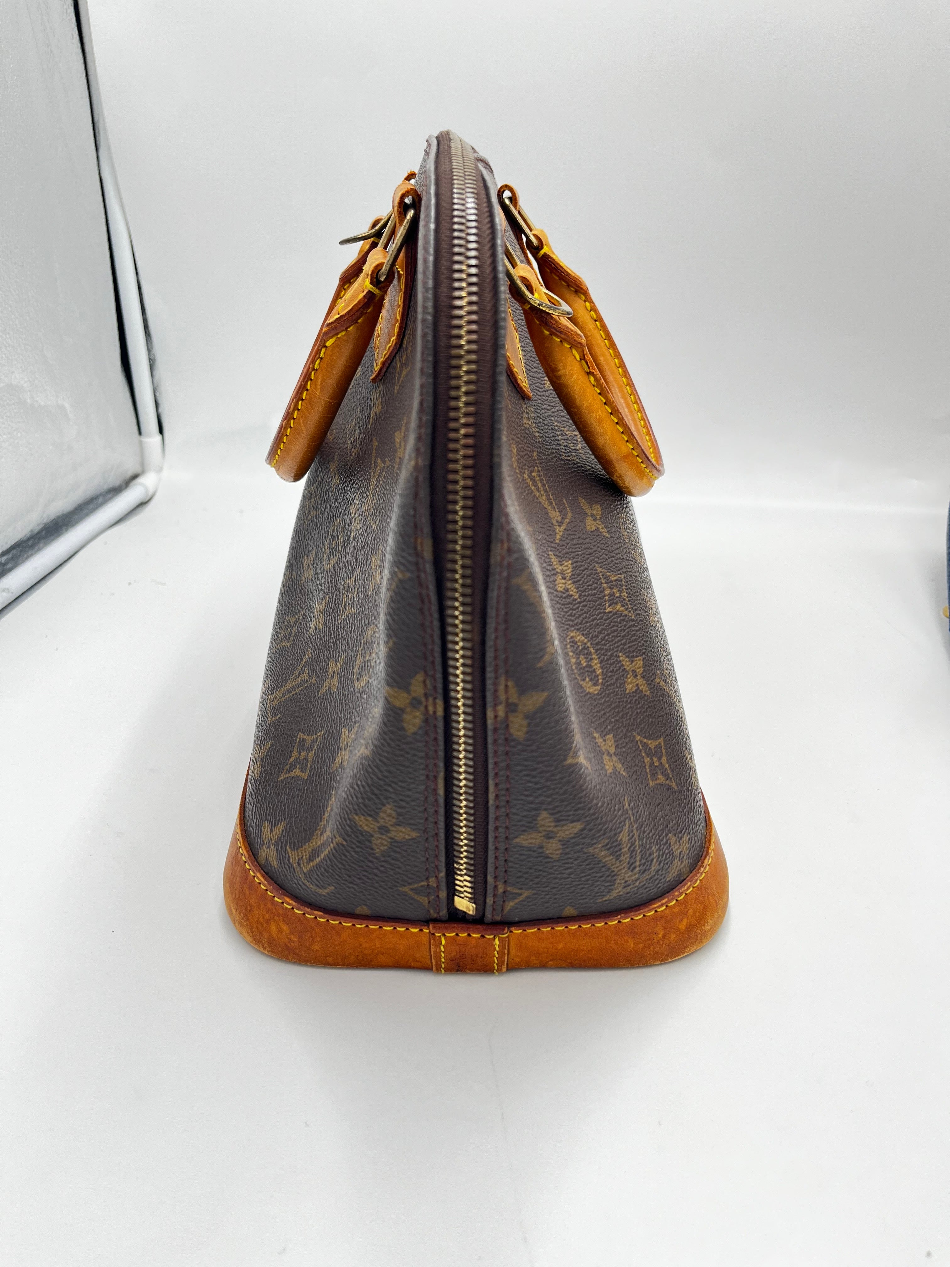 Louis Vuitton Alma Handbag Monogram Canvas Brown Canvas Handbag (Pre-Owned)