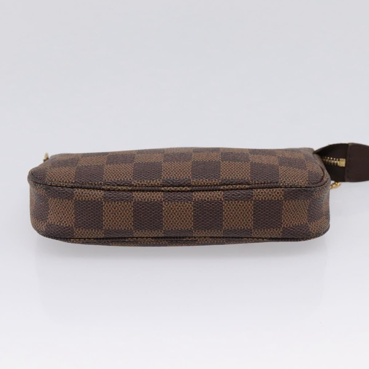 Louis Vuitton Mini Pochette Accessoires Damier Canvas Brown Canvas Clutche & Pouche Bag (Pre-Owned)
