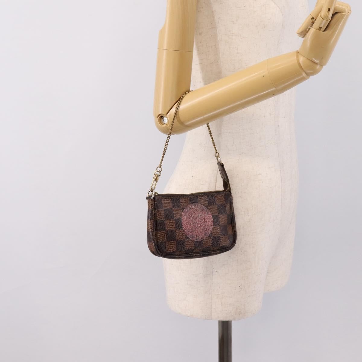 Louis Vuitton Mini Pochette Accessoires Damier Canvas Brown Canvas Clutche & Pouche Bag (Pre-Owned)