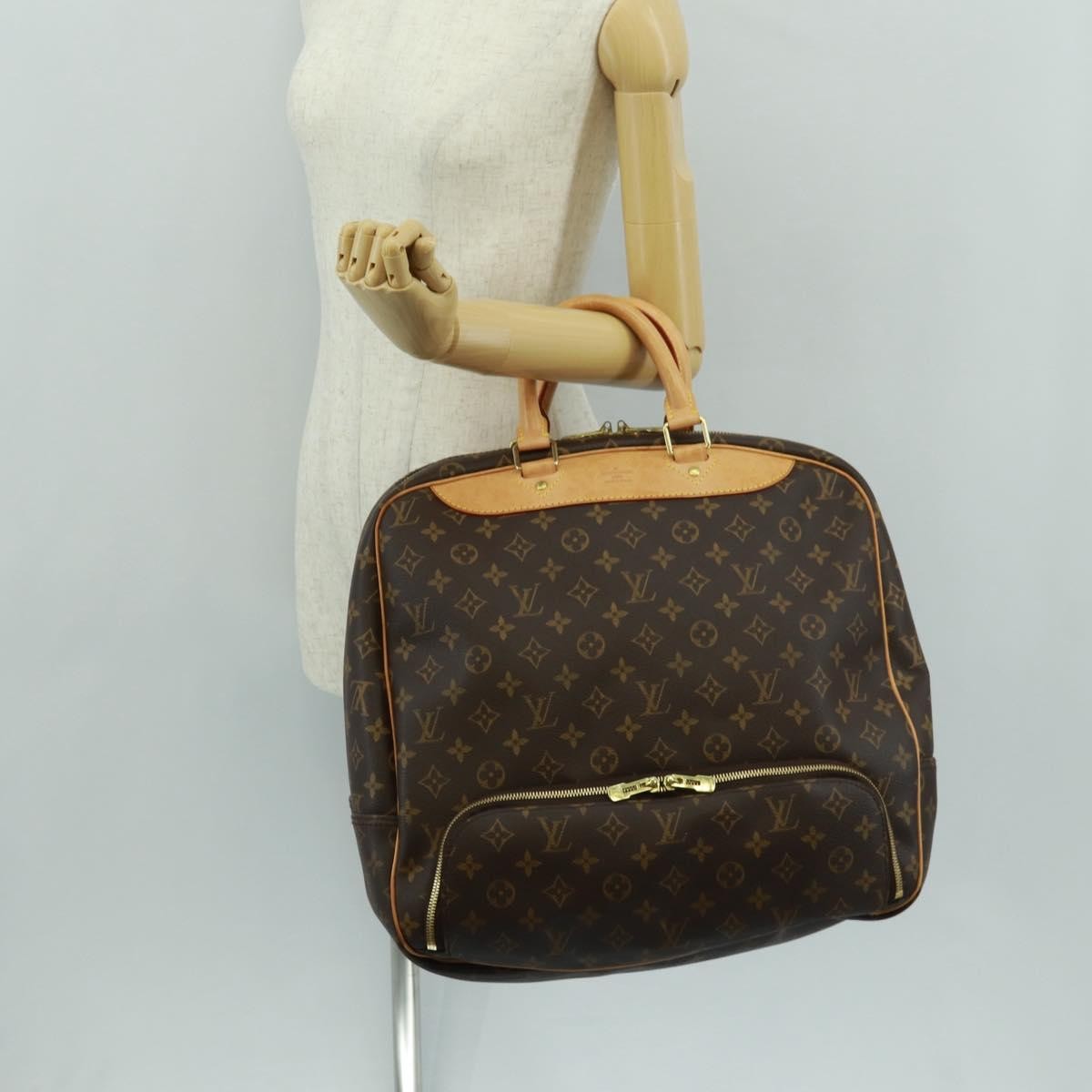 Louis Vuitton Evasion Monogram Canvas Brown Canvas Travel Bag Bag (Pre-Owned)