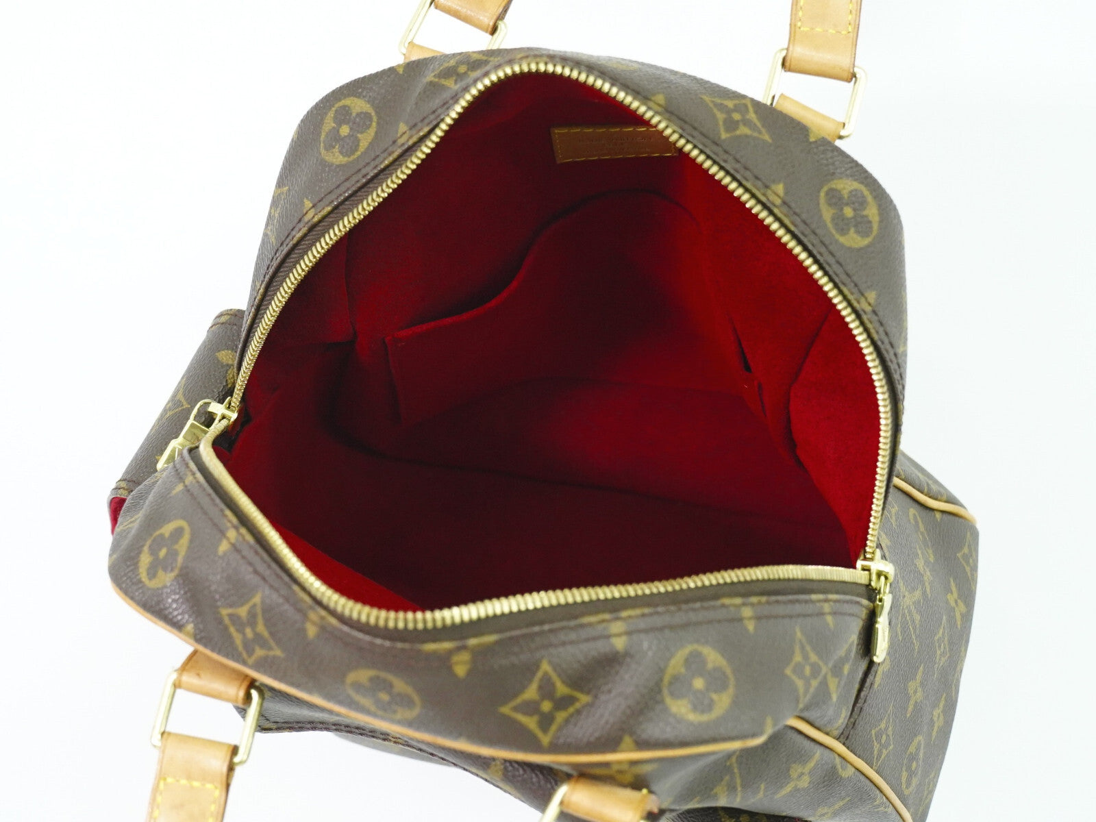 Louis Vuitton Excentri-Cite Monogram Canvas Brown Canvas Handbag (Pre-Owned)