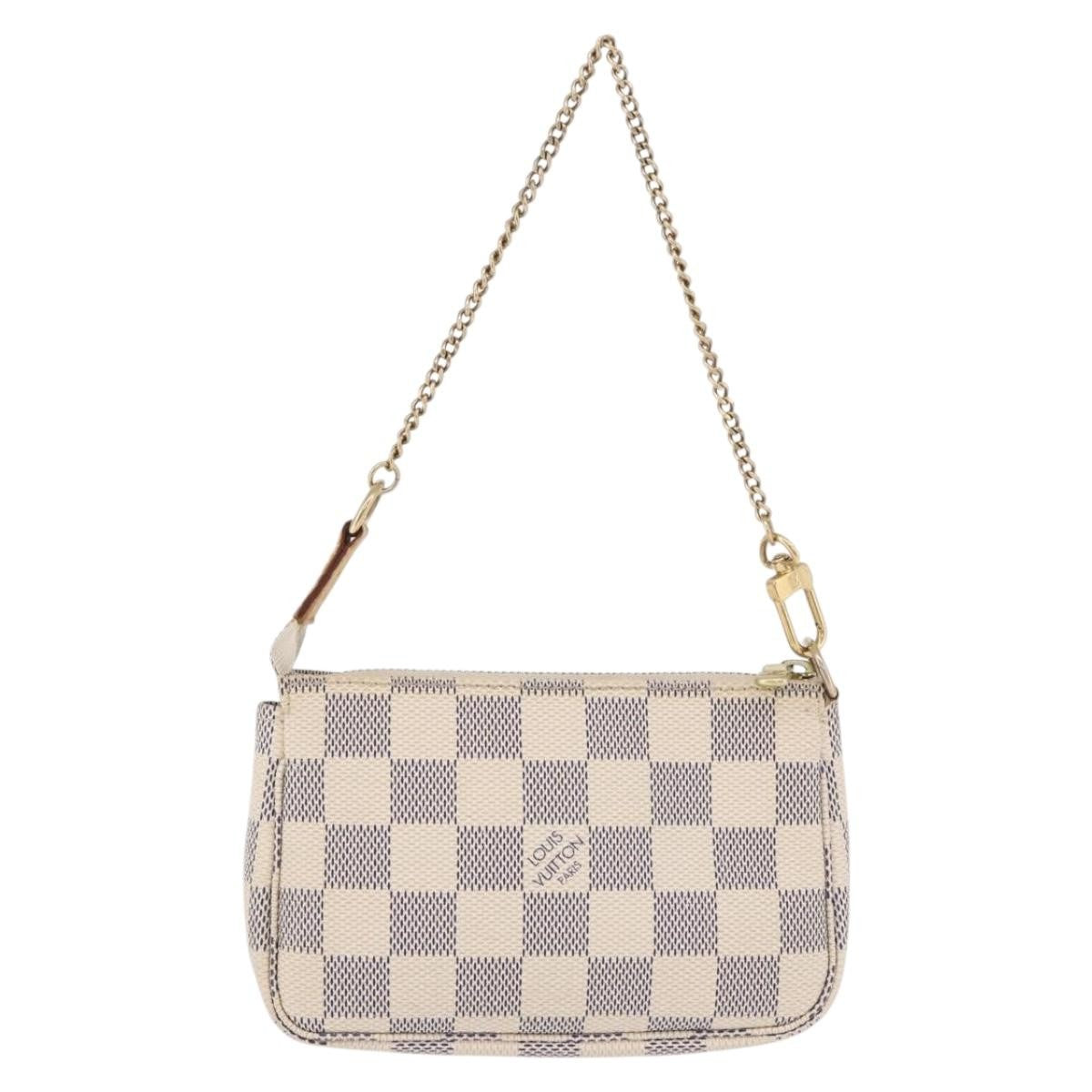 Louis Vuitton Mini Pochette Accessoires Damier Canvas Beige Canvas Clutche & Pouche Bag (Pre-Owned)