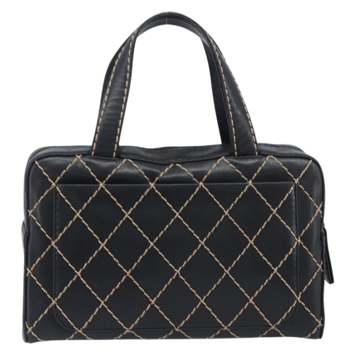 Chanel Surpique Boston Quilted Leather Black Leather Handbag (Pre-Owned)