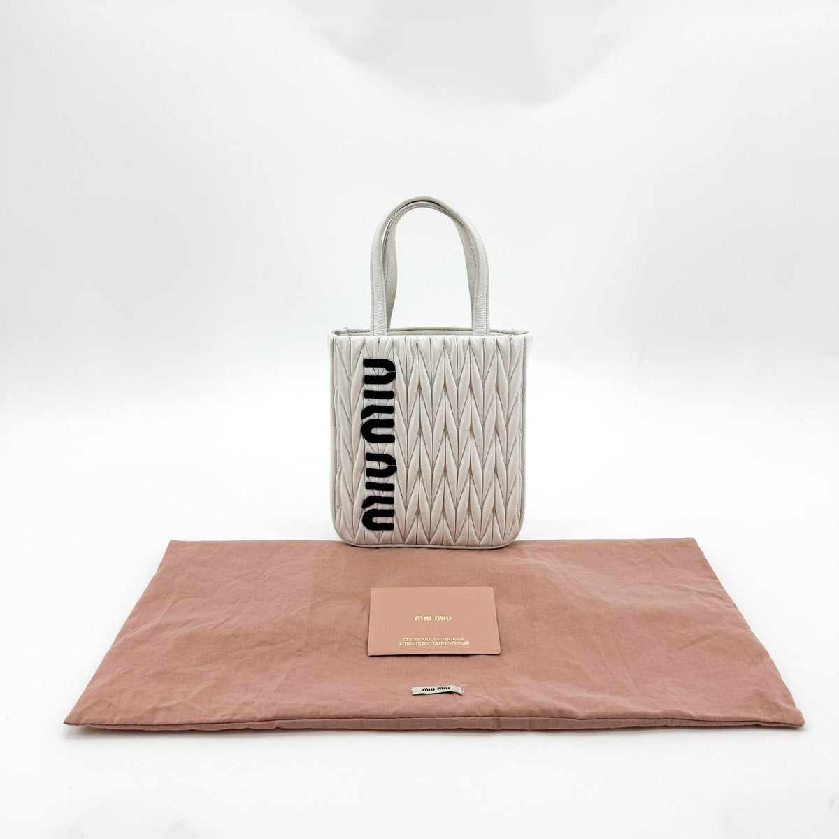Miu Miu Matelassé Nappa Leather Top Handle Bag Leather White Leather Clutche & Pouche Bag (Pre-Owned)