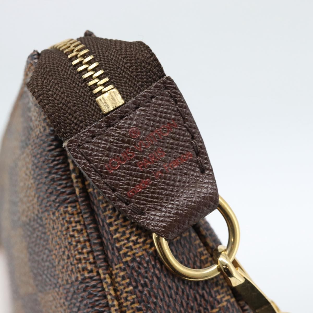 Louis Vuitton Mini Pochette Accessoires Damier Canvas Brown Canvas Clutche & Pouche Bag (Pre-Owned)
