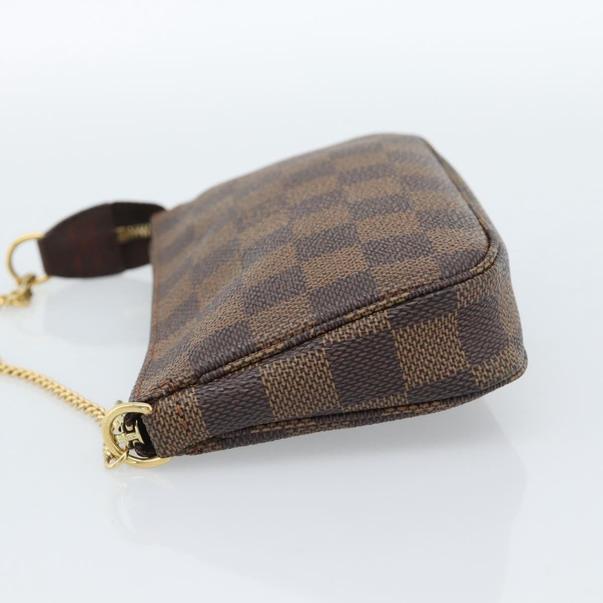 Louis Vuitton Mini Pochette Accessoires Damier Canvas Brown Canvas Clutche & Pouche Bag (Pre-Owned)
