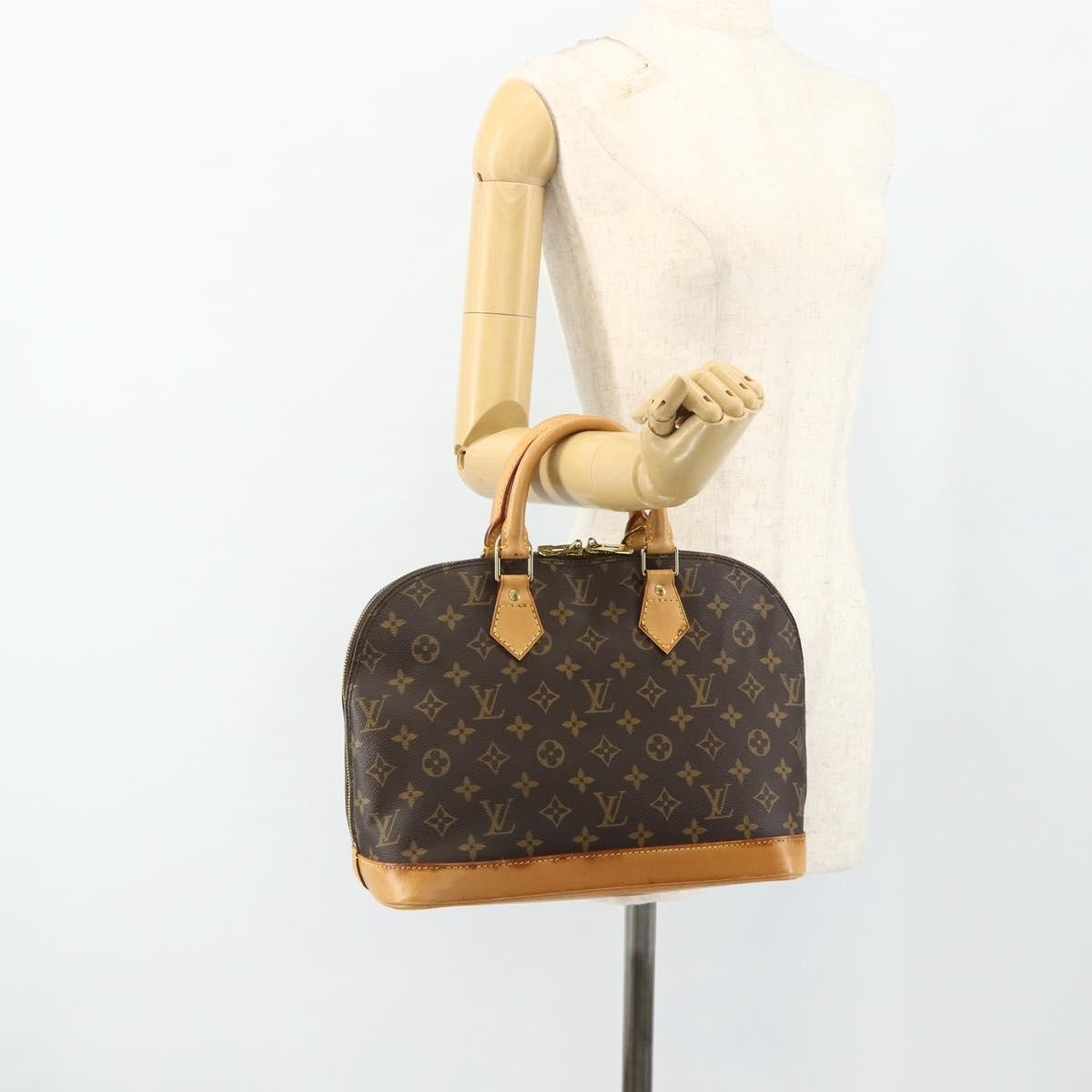 Louis Vuitton Alma Handbag Monogram Canvas Brown Canvas Handbag (Pre-Owned)