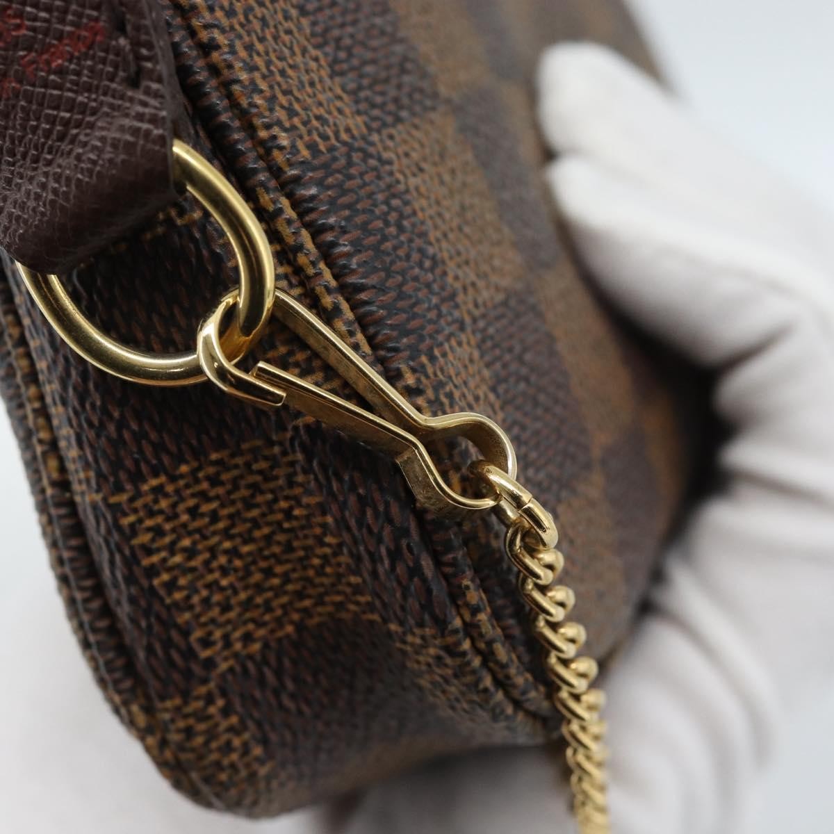 Louis Vuitton Mini Pochette Accessoires Damier Canvas Brown Canvas Clutche & Pouche Bag (Pre-Owned)