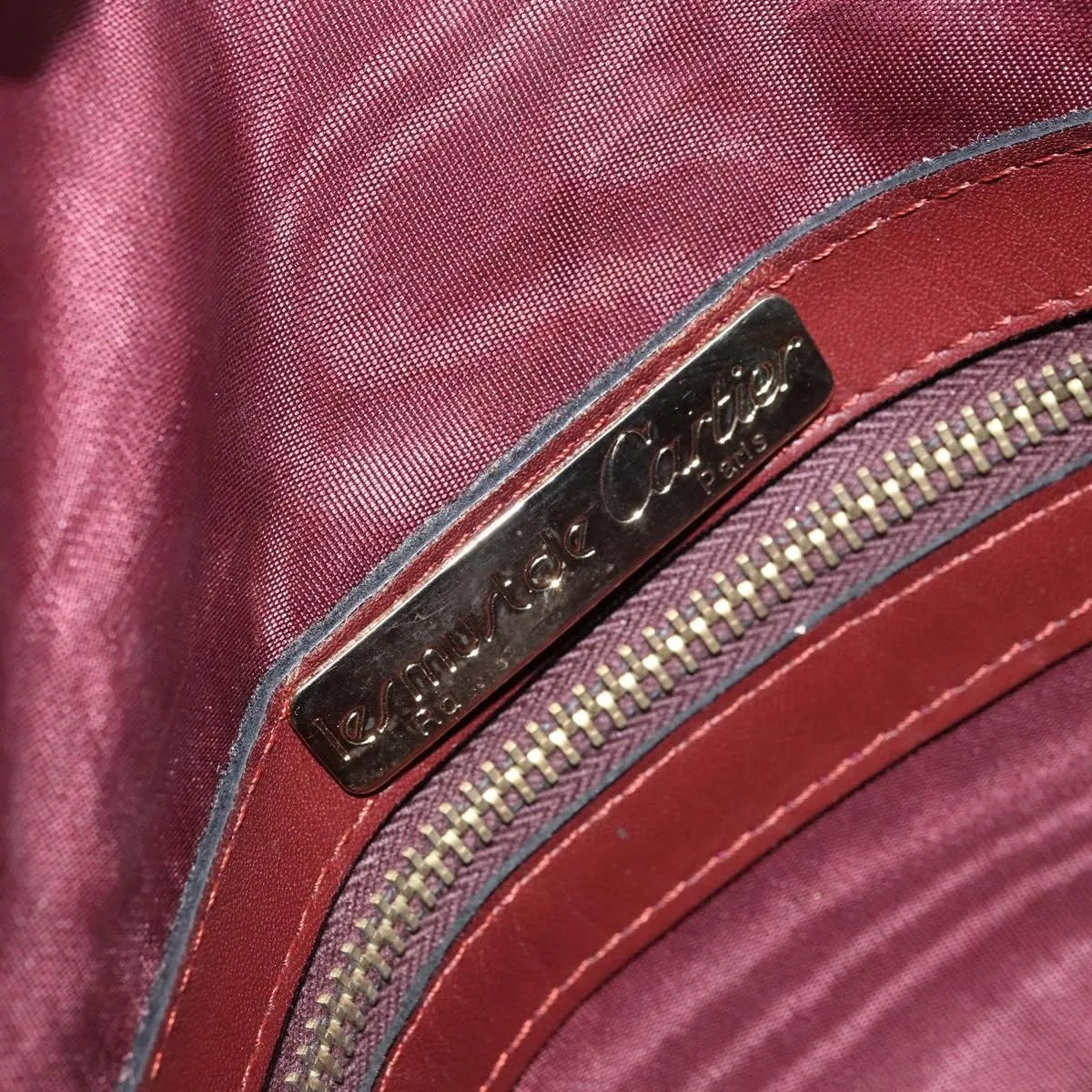 Cartier Must De Cartier Leather Burgundy Leather Handbag (Pre-Owned)
