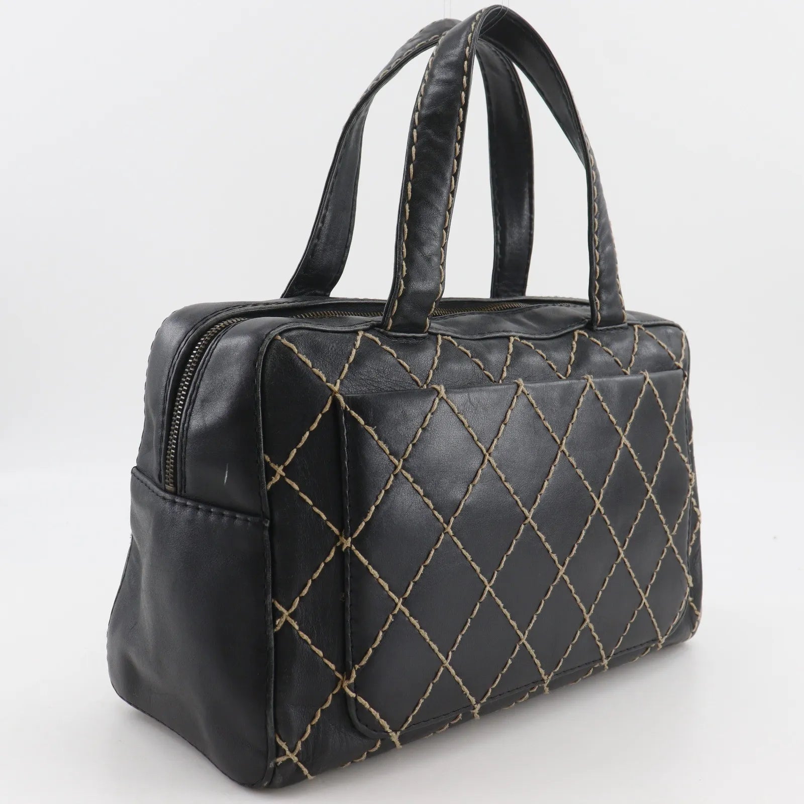 Chanel Surpique Boston Quilted Leather Black Leather Handbag (Pre-Owned)