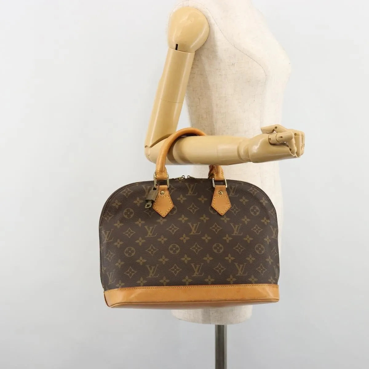 Louis Vuitton Alma Monogram Canvas Brown Canvas Handbag (Pre-Owned)