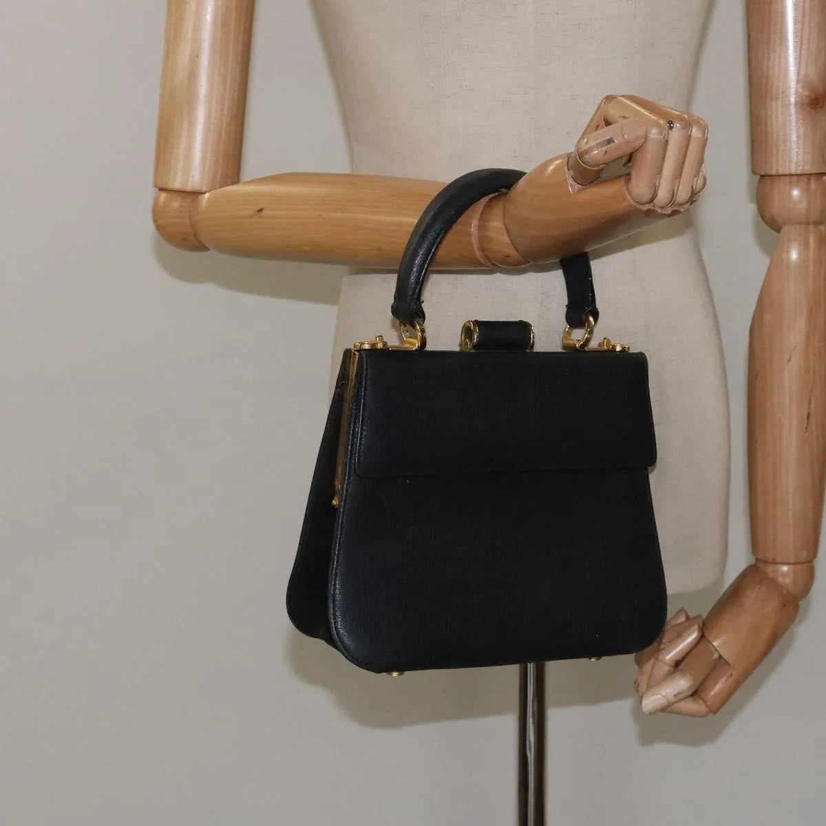 Salvatore Ferragamo Convertible Top Handle Leather Black Leather Handbag (Pre-Owned)