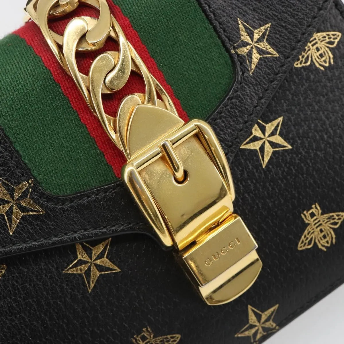 Gucci Sylvie Top Handle Printed Leather Black Leather Handbag (Pre-Owned)
