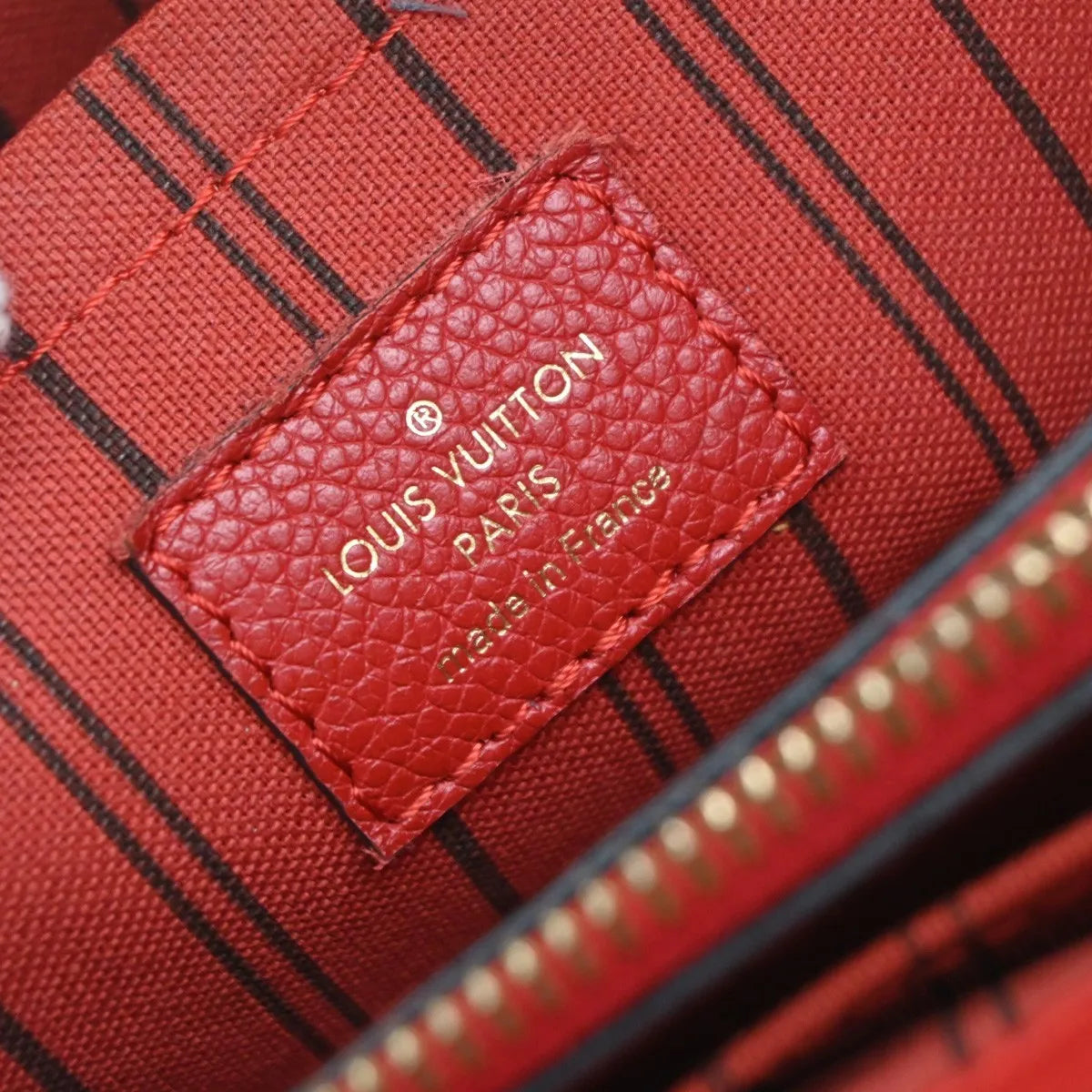 Louis Vuitton Montaigne Monogram Empreinte Leather Red Leather Handbag (Pre-Owned)