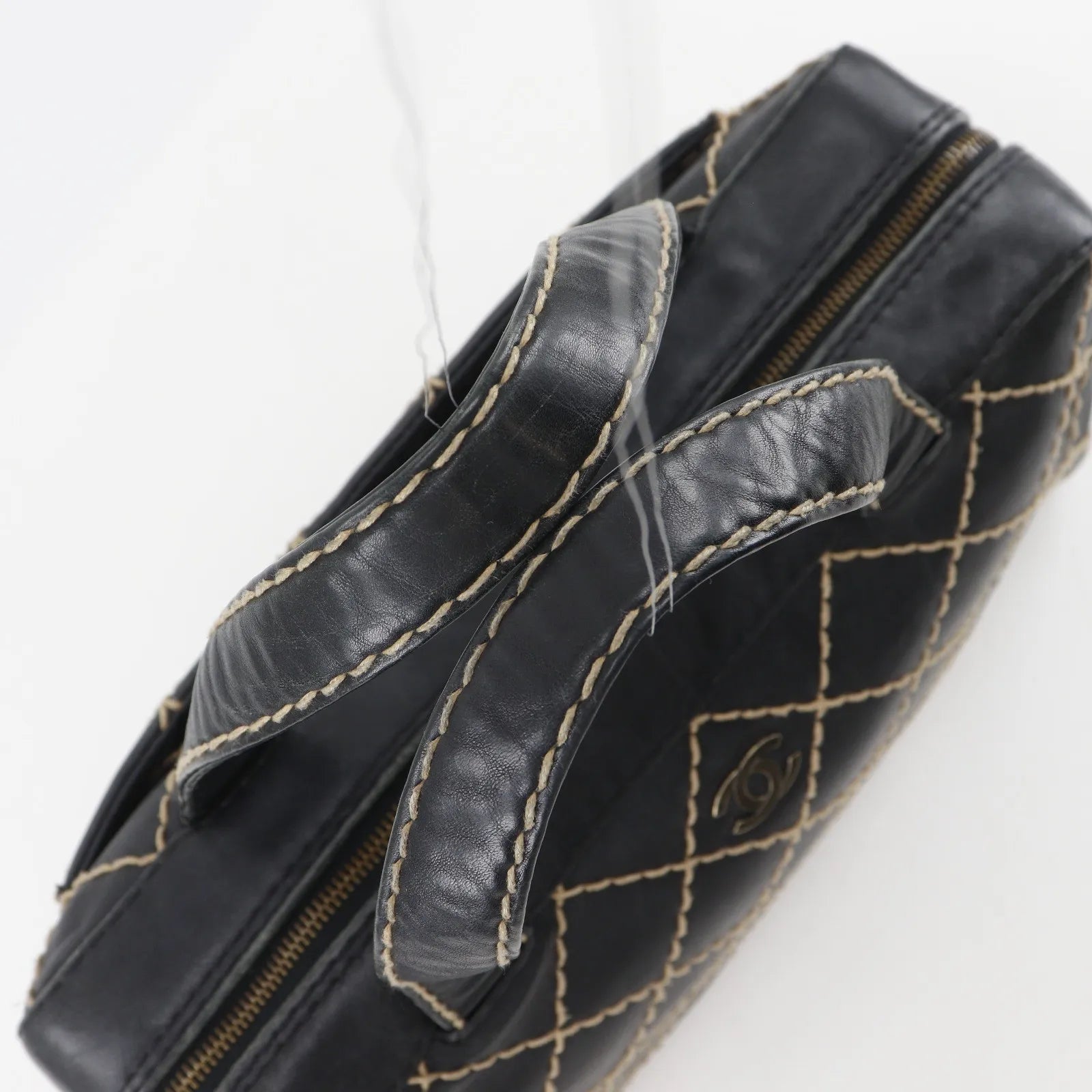 Chanel Surpique Boston Quilted Leather Black Leather Handbag (Pre-Owned)